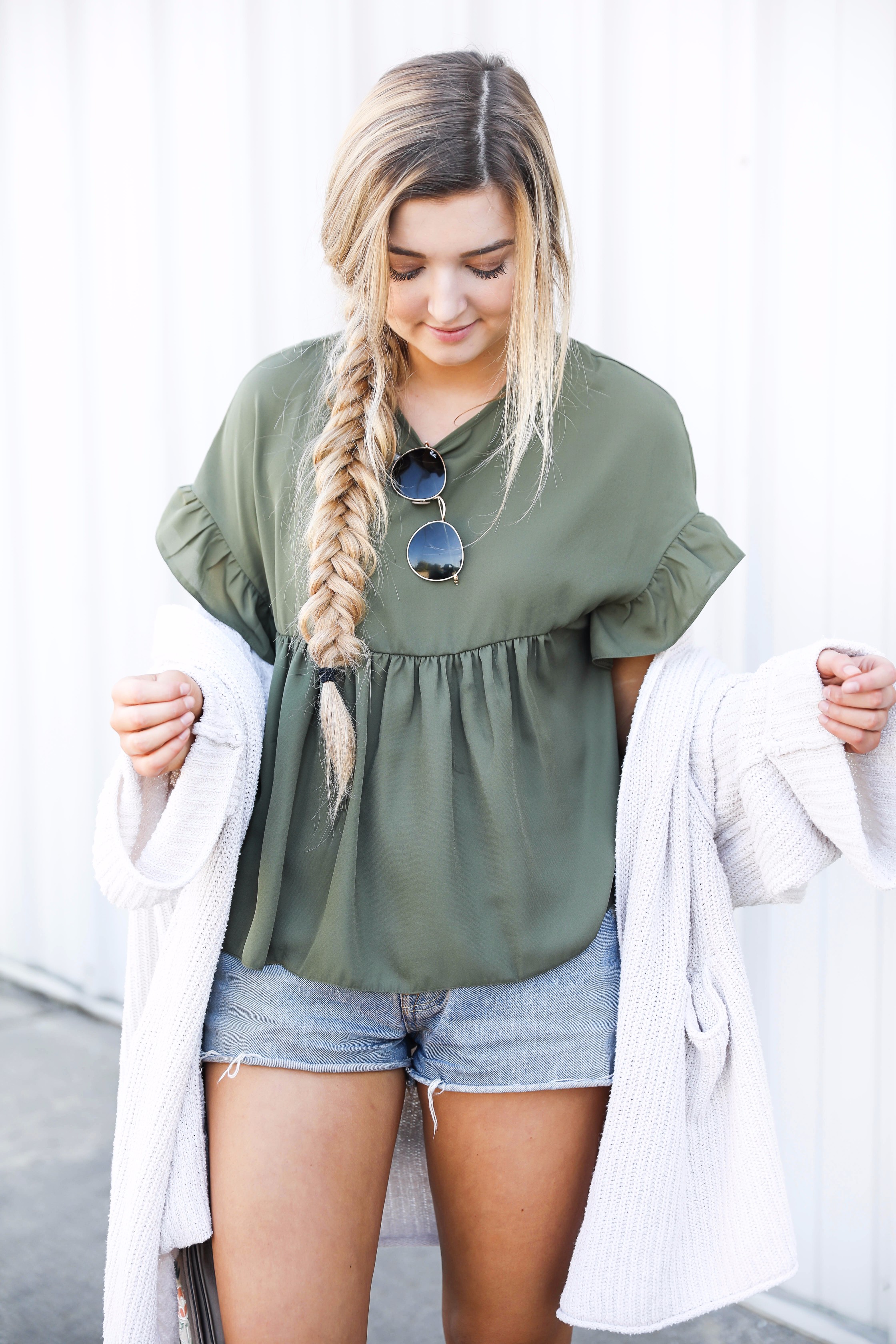 Olive ruffle top with a free people slouchy cardigan! I love olive for fall. This look is autumn perfection with the booties! Find the details on fashion blog daily dose of charm by lauren lindmark