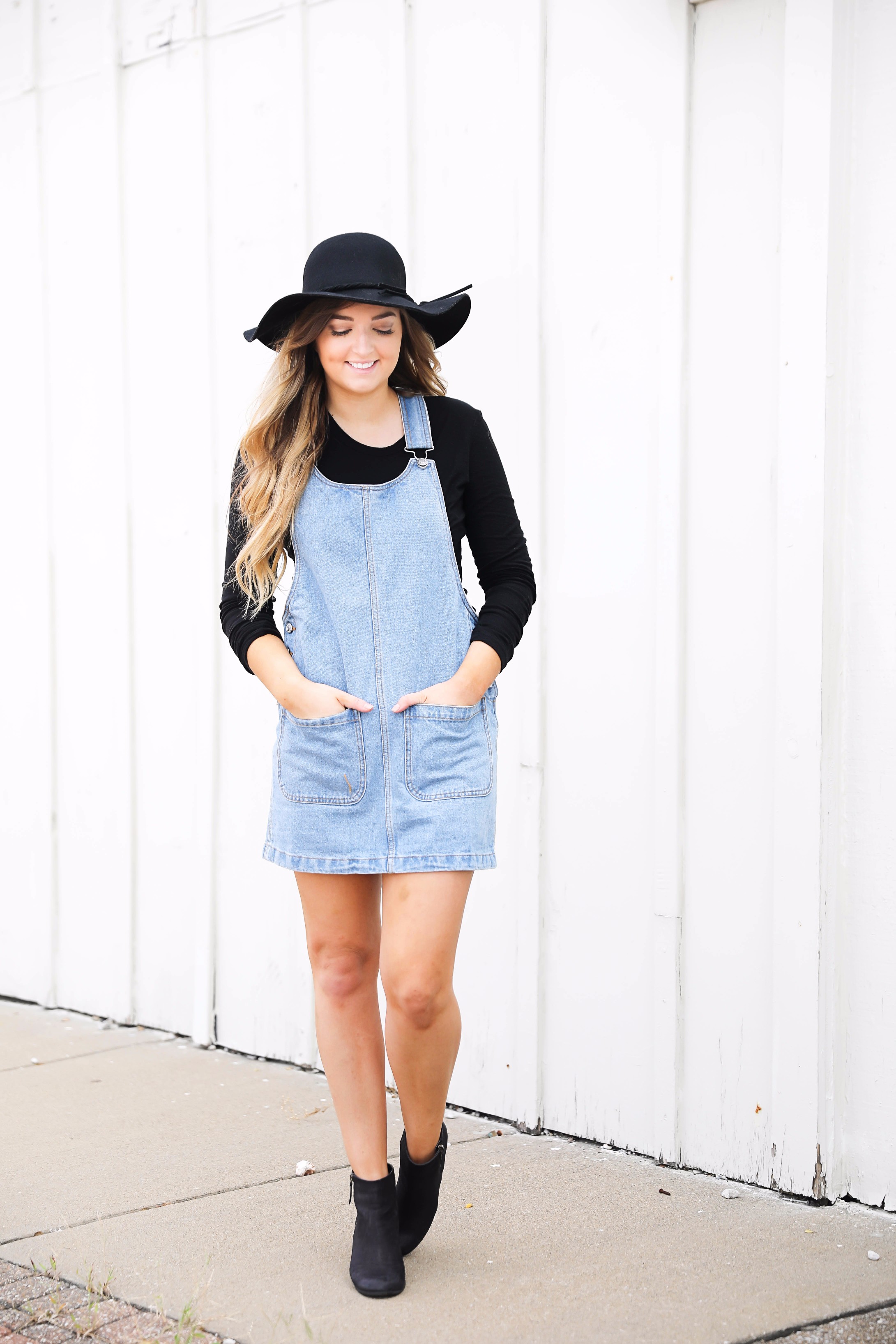 Fall outfit idea! Overall dress and black floppy hat and black booties! I love this look! Find the details on fashion blog daily dose of charm by lauren lindmark