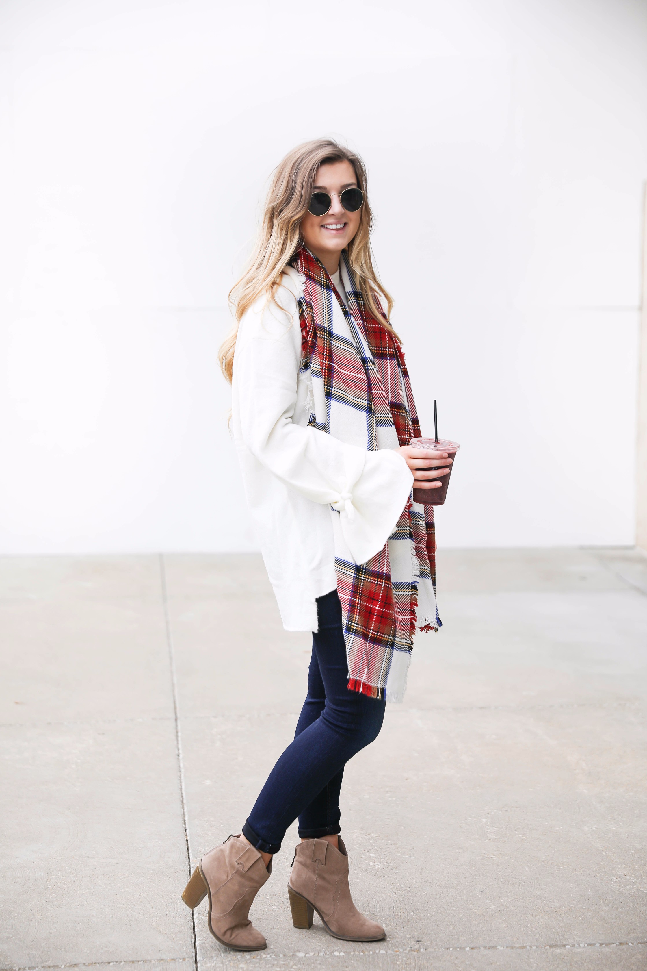Tied bow sleeve sweater with a plaid blanket scarf! I love blanket scarves for fall. This outfit is perfect with dark jeans and booties! Details on fashion blog daily dose of charm by lauren lindmark