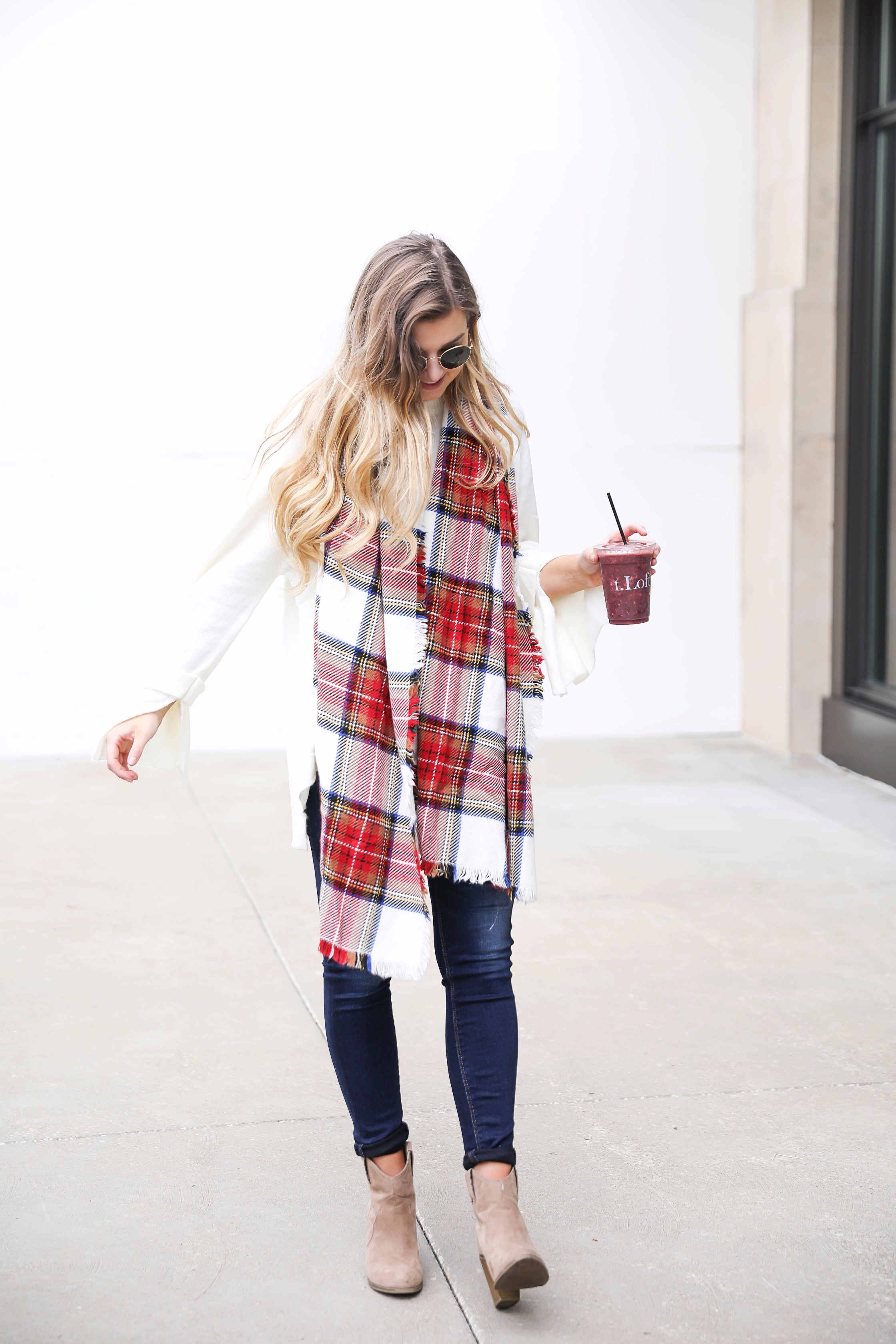 Tied bow sleeve sweater with a plaid blanket scarf! I love blanket scarves for fall. This outfit is perfect with dark jeans and booties! Details on fashion blog daily dose of charm by lauren lindmark