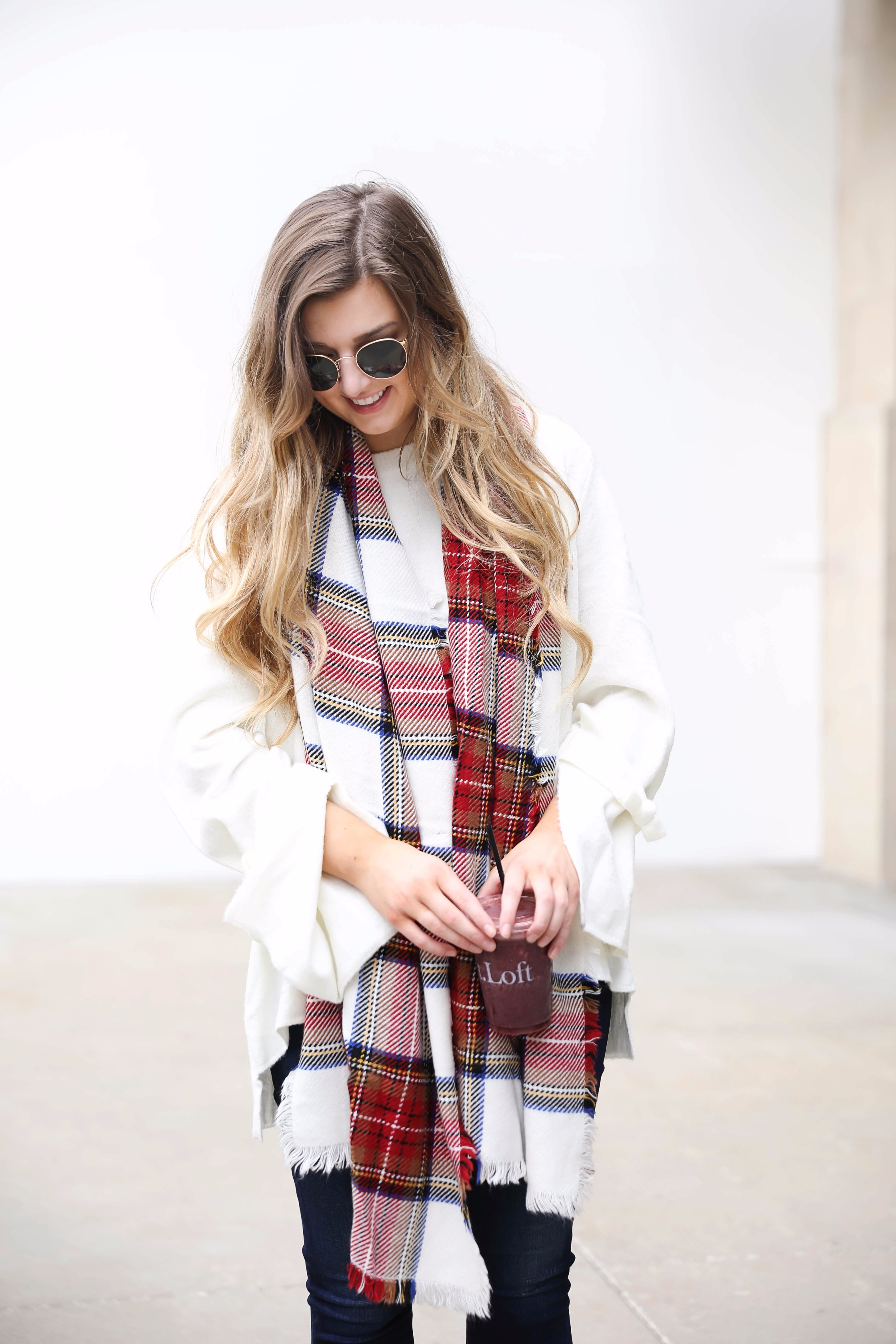 Tied bow sleeve sweater with a plaid blanket scarf! I love blanket scarves for fall. This outfit is perfect with dark jeans and booties! Details on fashion blog daily dose of charm by lauren lindmark