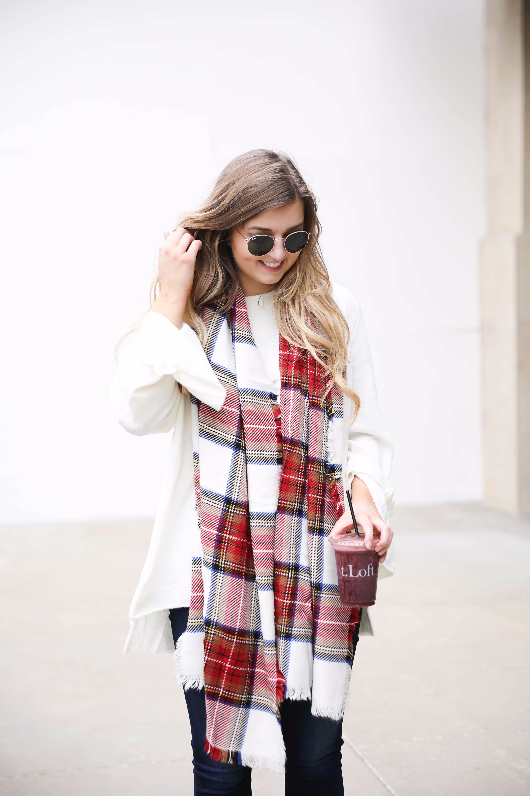 Tied bow sleeve sweater with a plaid blanket scarf! I love blanket scarves for fall. This outfit is perfect with dark jeans and booties! Details on fashion blog daily dose of charm by lauren lindmark