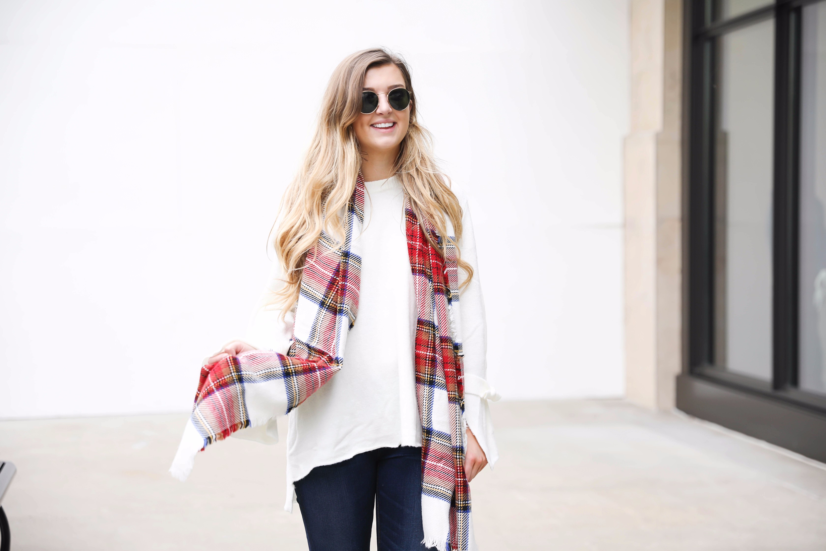 Tied bow sleeve sweater with a plaid blanket scarf! I love blanket scarves for fall. This outfit is perfect with dark jeans and booties! Details on fashion blog daily dose of charm by lauren lindmark