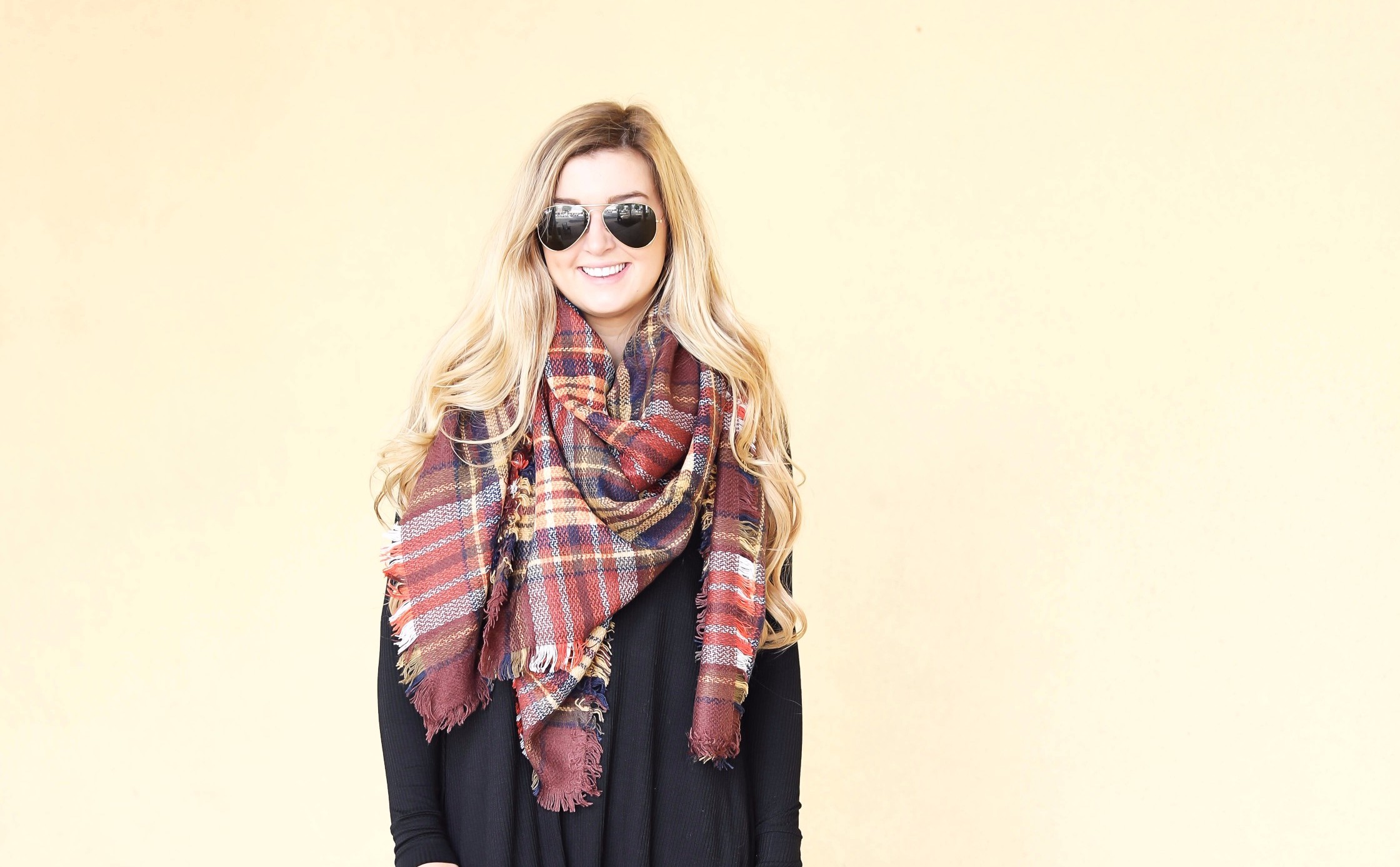 Plaid blanket scarf by ILY Mix paired with a cute black long sleeve dress and booties on fashion blog daily dose of charm