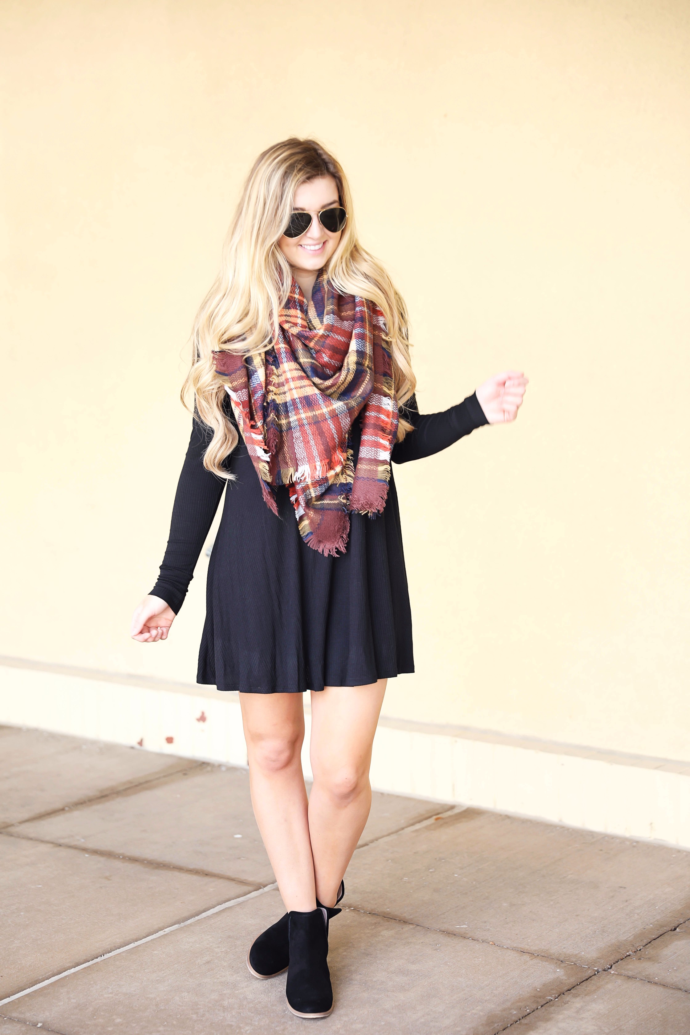 Plaid blanket scarf by ILY Mix paired with a cute black long sleeve dress and booties on fashion blog daily dose of charm