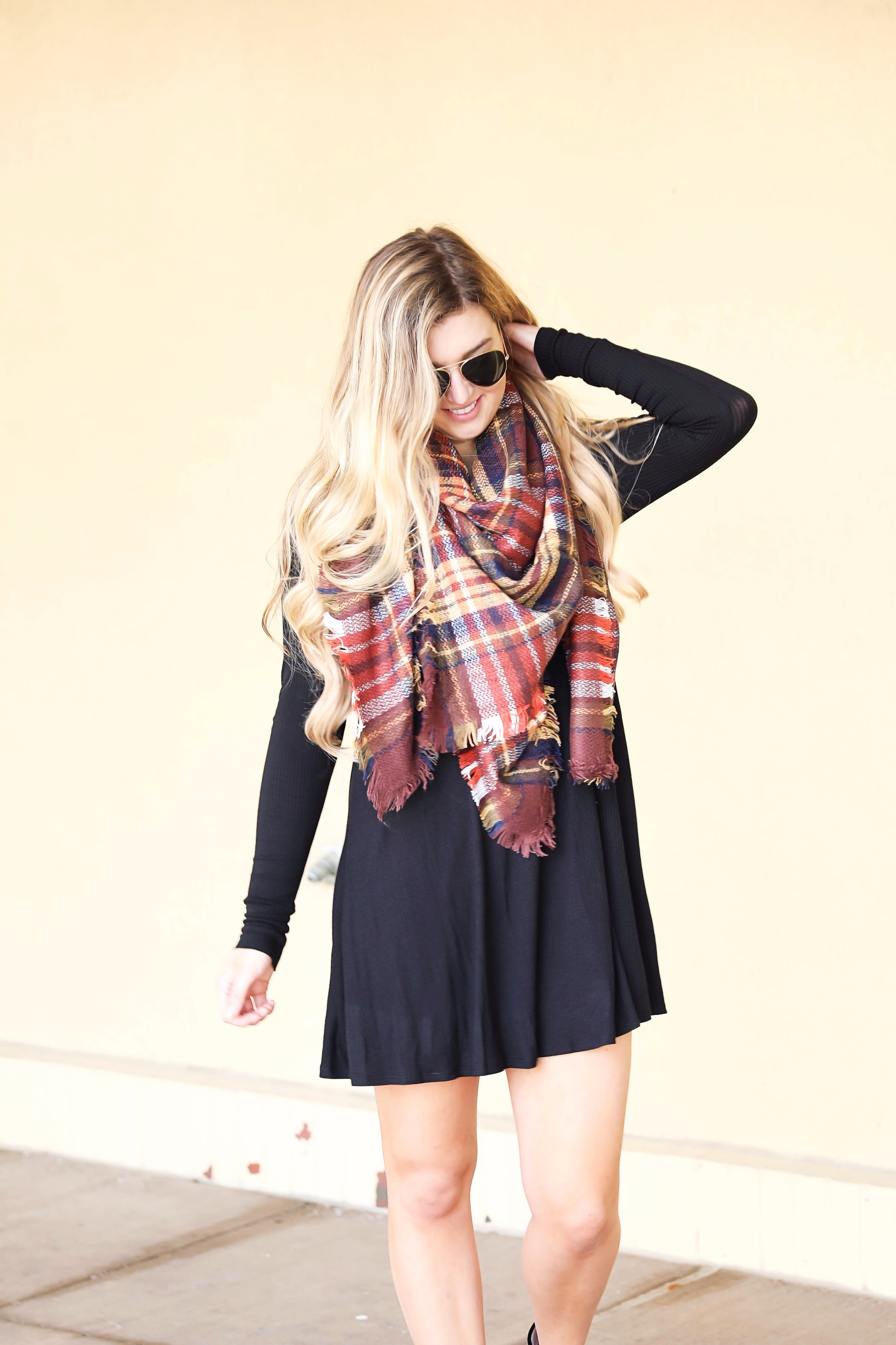 Plaid blanket scarf by ILY Mix paired with a cute black long sleeve dress and booties on fashion blog daily dose of charm