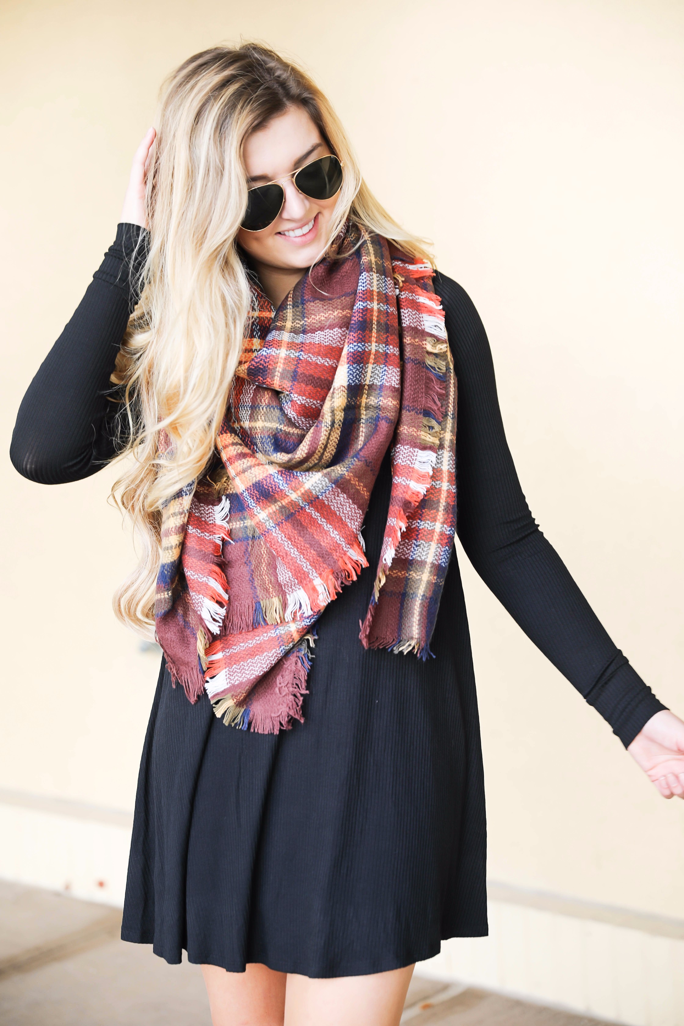 Plaid blanket scarf by ILY Mix paired with a cute black long sleeve dress and booties on fashion blog daily dose of charm