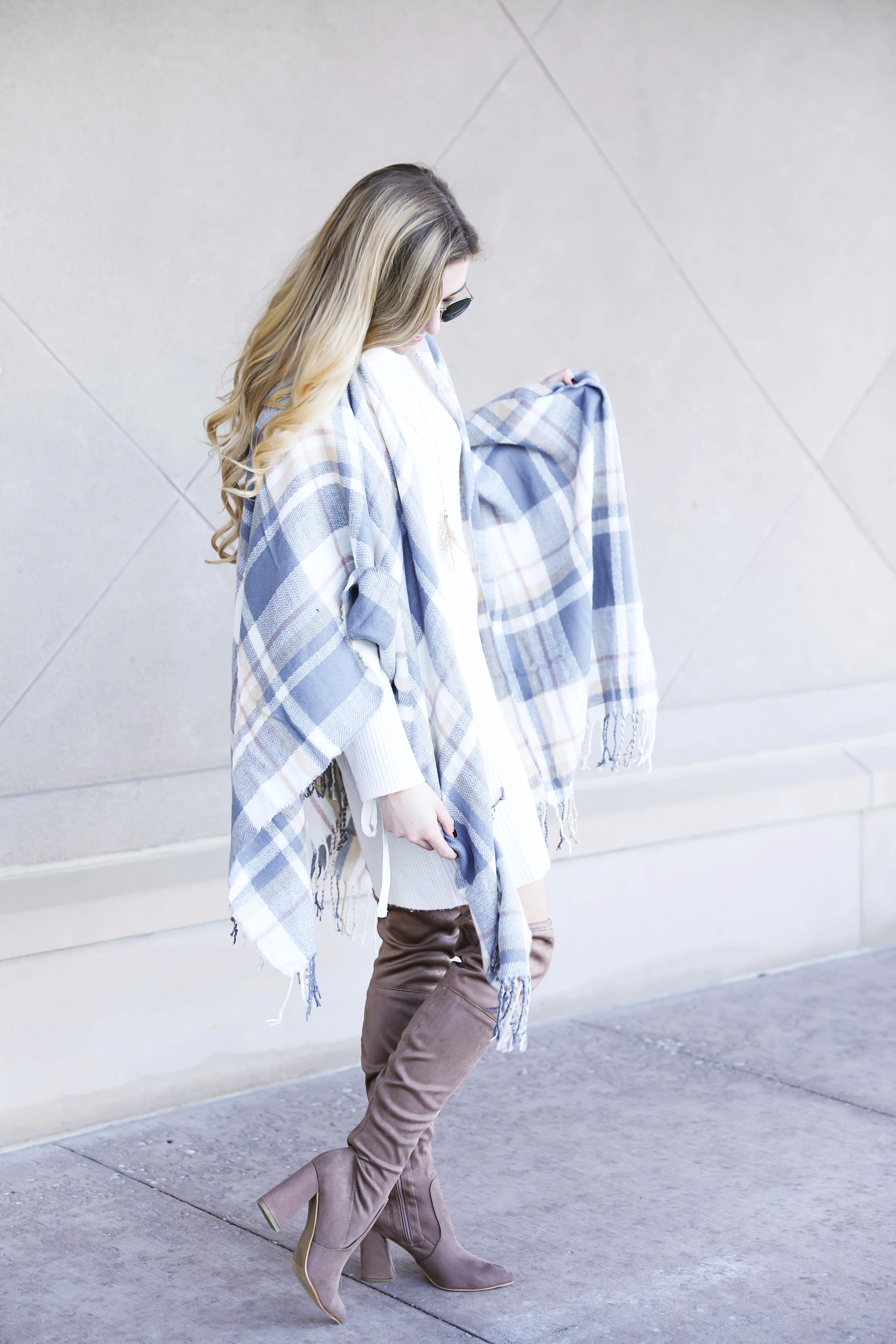 Plaid poncho and cute white sweater dress with tied sleeves! Cutest fall outfit! Check out the details on fashion blog daily dose of charm by lauren lindmark