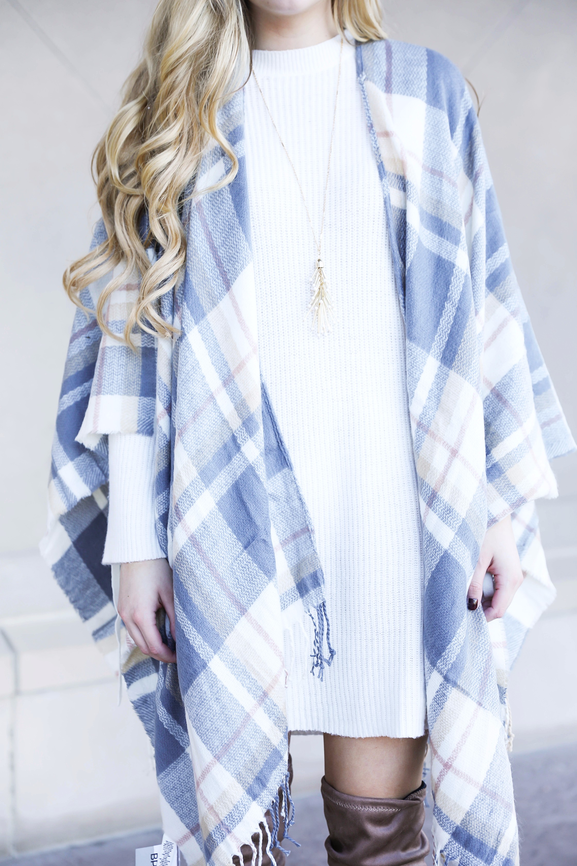 Plaid poncho and cute white sweater dress with tied sleeves! Cutest fall outfit! Check out the details on fashion blog daily dose of charm by lauren lindmark