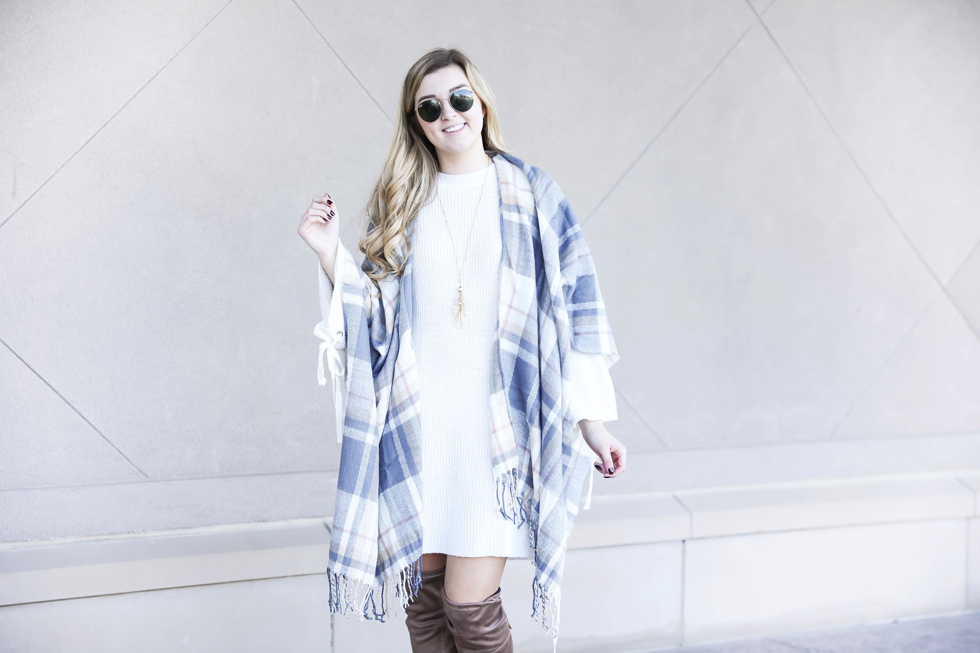 Plaid poncho and cute white sweater dress with tied sleeves! Cutest fall outfit! Check out the details on fashion blog daily dose of charm by lauren lindmark