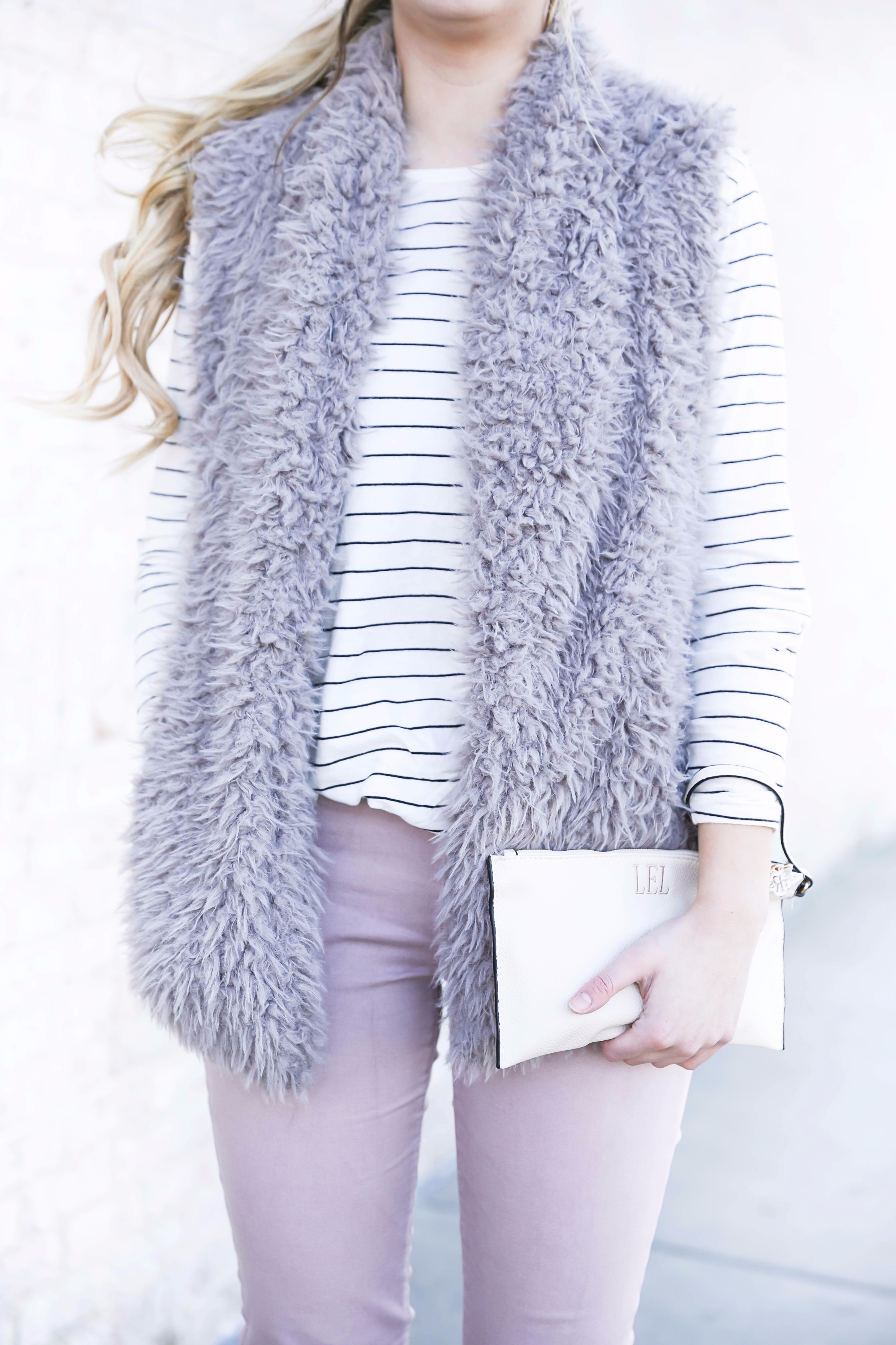 Striped long sleeve t-shirt and faux fur vest with pink pants! Details on fashion blog daily dose of charm by lauren lindmark