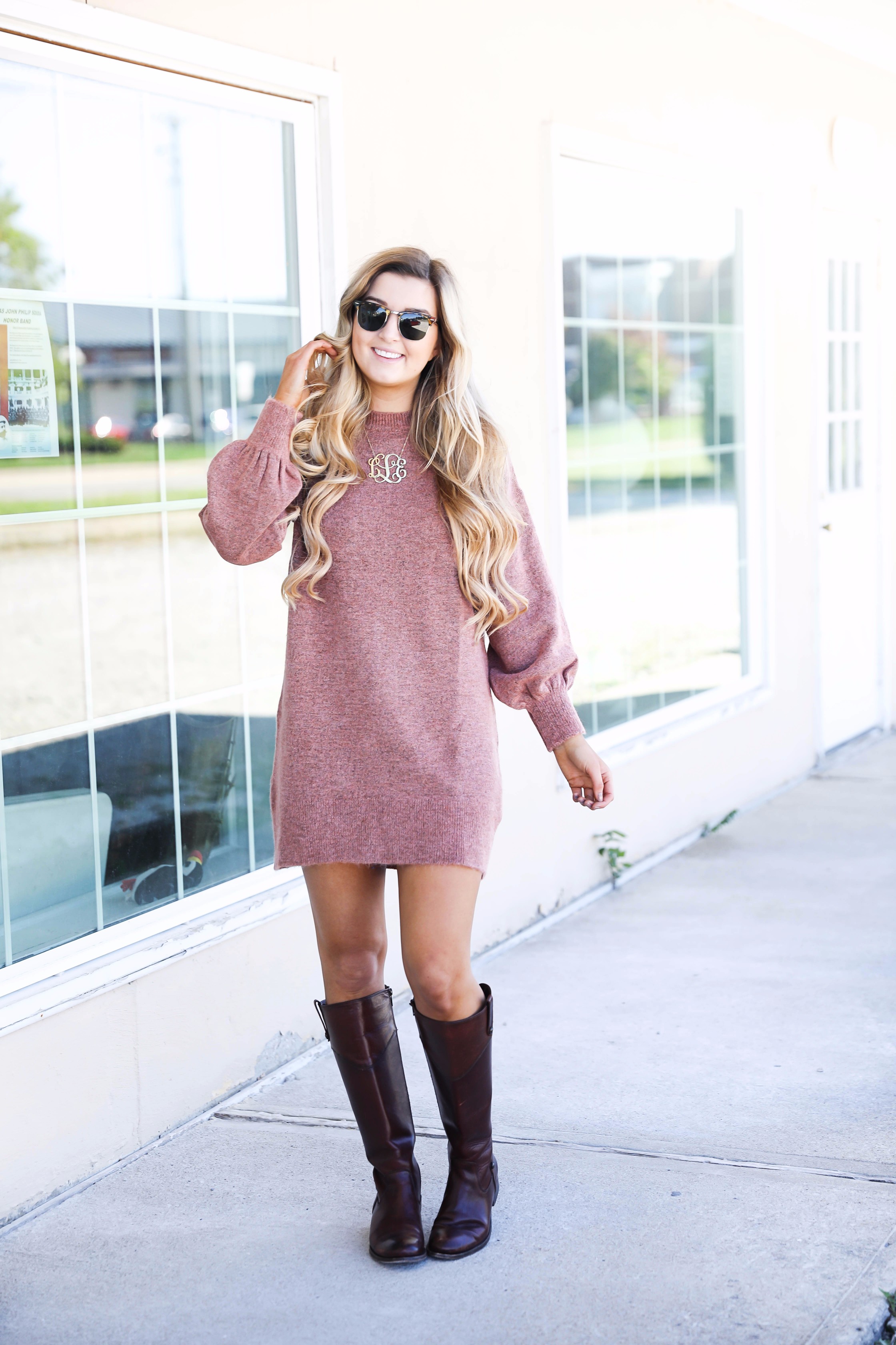 Sweater dress with puffy sleeves and brown riding boots! Paired with a large monogram necklace, perfect fall outfit! Details on fashion blog daily dose of charm by lauren lindmark