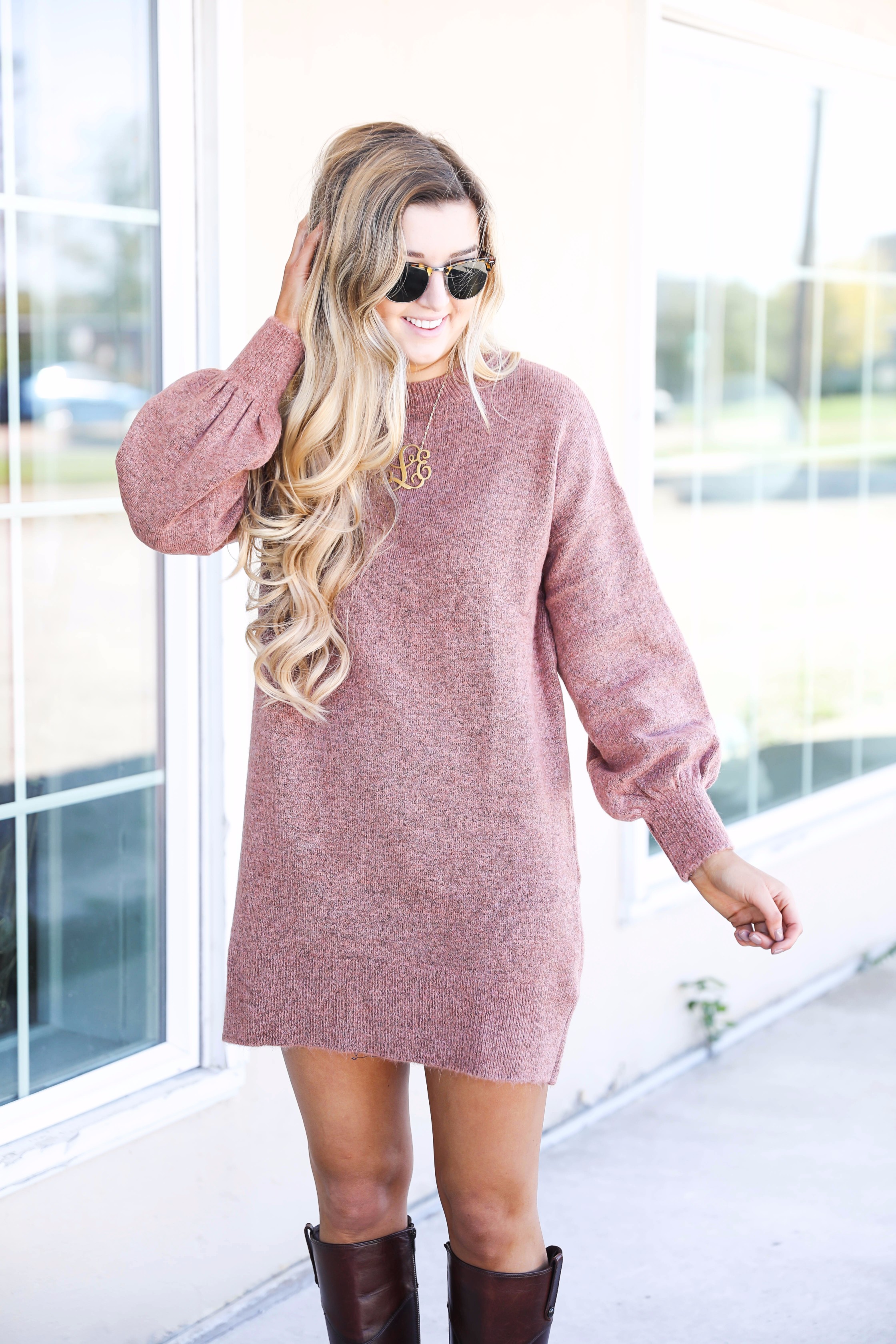 Sweater dress with puffy sleeves and brown riding boots! Paired with a large monogram necklace, perfect fall outfit! Details on fashion blog daily dose of charm by lauren lindmark