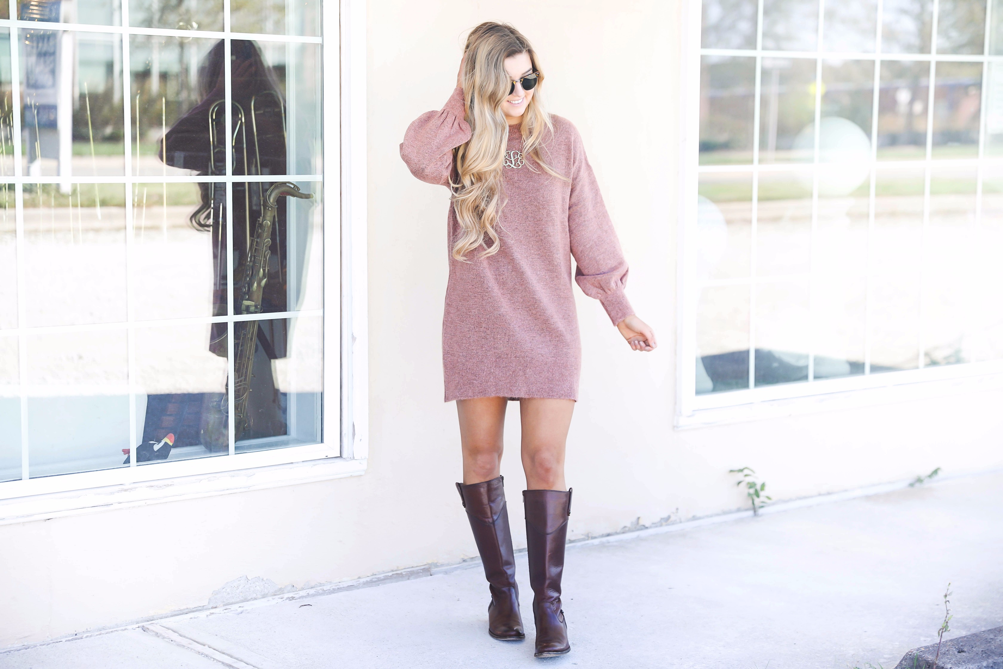 Sweater dress with puffy sleeves and brown riding boots! Paired with a large monogram necklace, perfect fall outfit! Details on fashion blog daily dose of charm by lauren lindmark