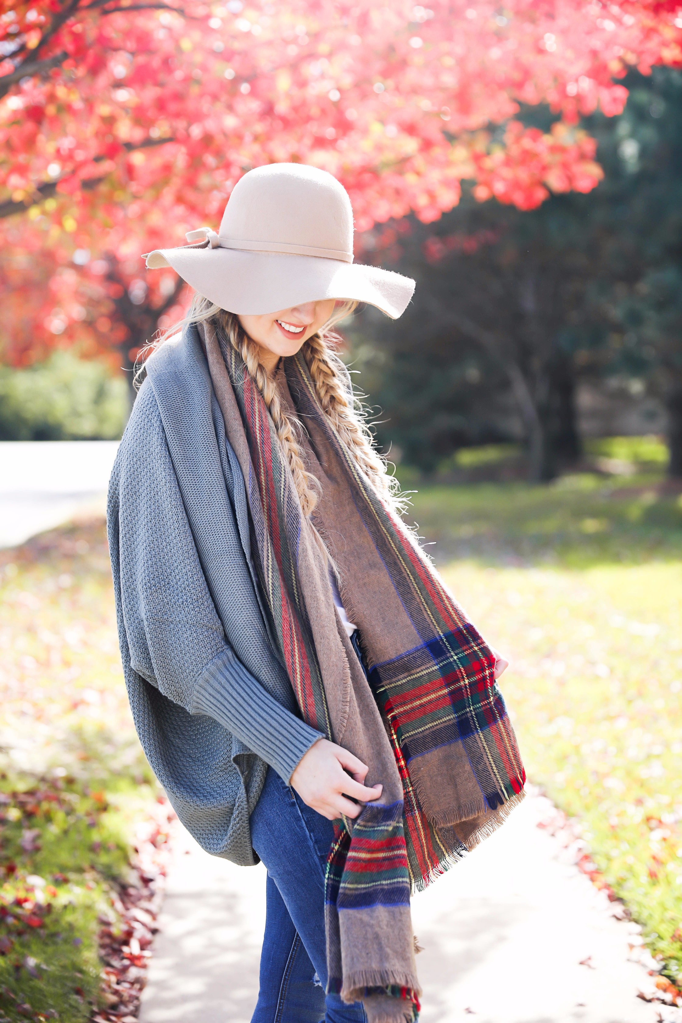 The perfect fall outfit with pretty fall leaves! Slouchy cardigan and plaid blanket scarf on fashion blog daily dose of charm by lauren lindmark