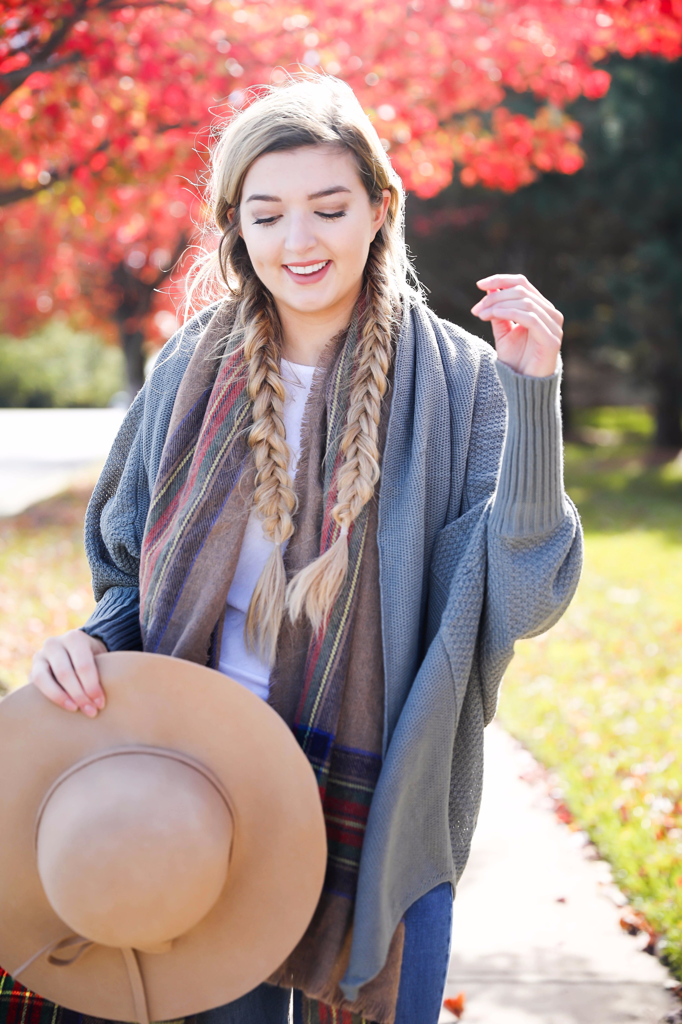 The perfect fall outfit with pretty fall leaves! Slouchy cardigan and plaid blanket scarf on fashion blog daily dose of charm by lauren lindmark