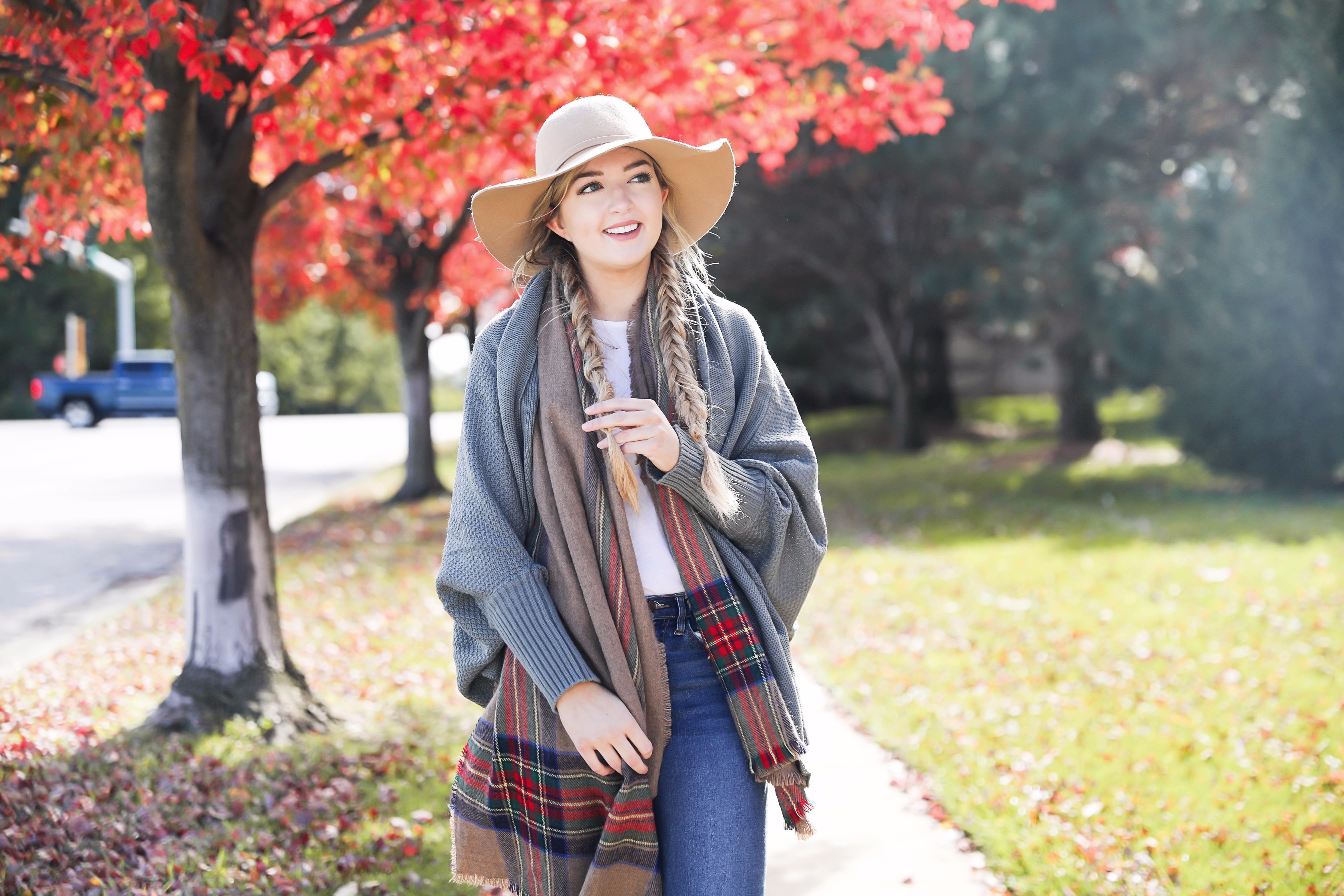 The perfect fall outfit with pretty fall leaves! Slouchy cardigan and plaid blanket scarf on fashion blog daily dose of charm by lauren lindmark