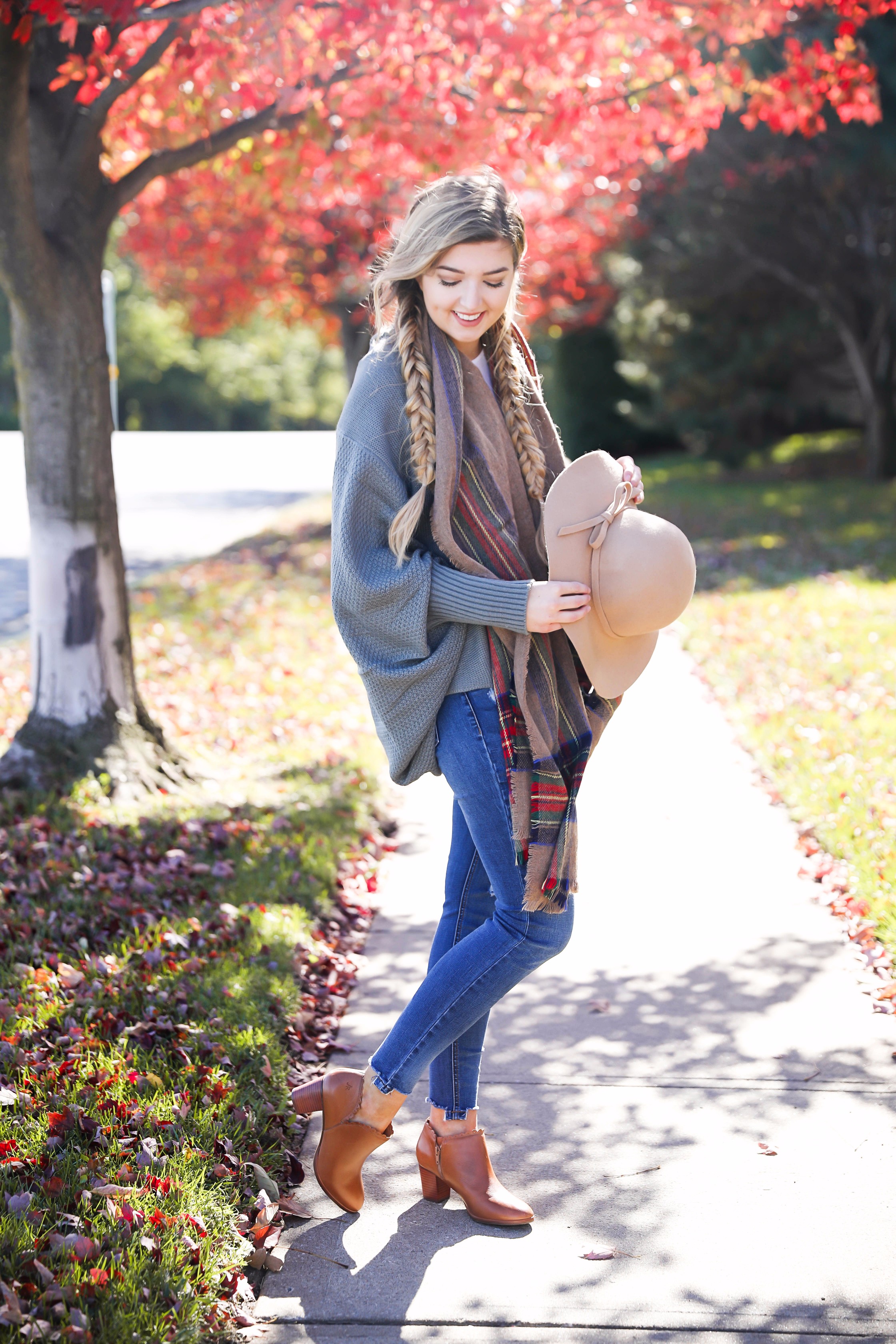 The perfect fall outfit with pretty fall leaves! Slouchy cardigan and plaid blanket scarf on fashion blog daily dose of charm by lauren lindmark