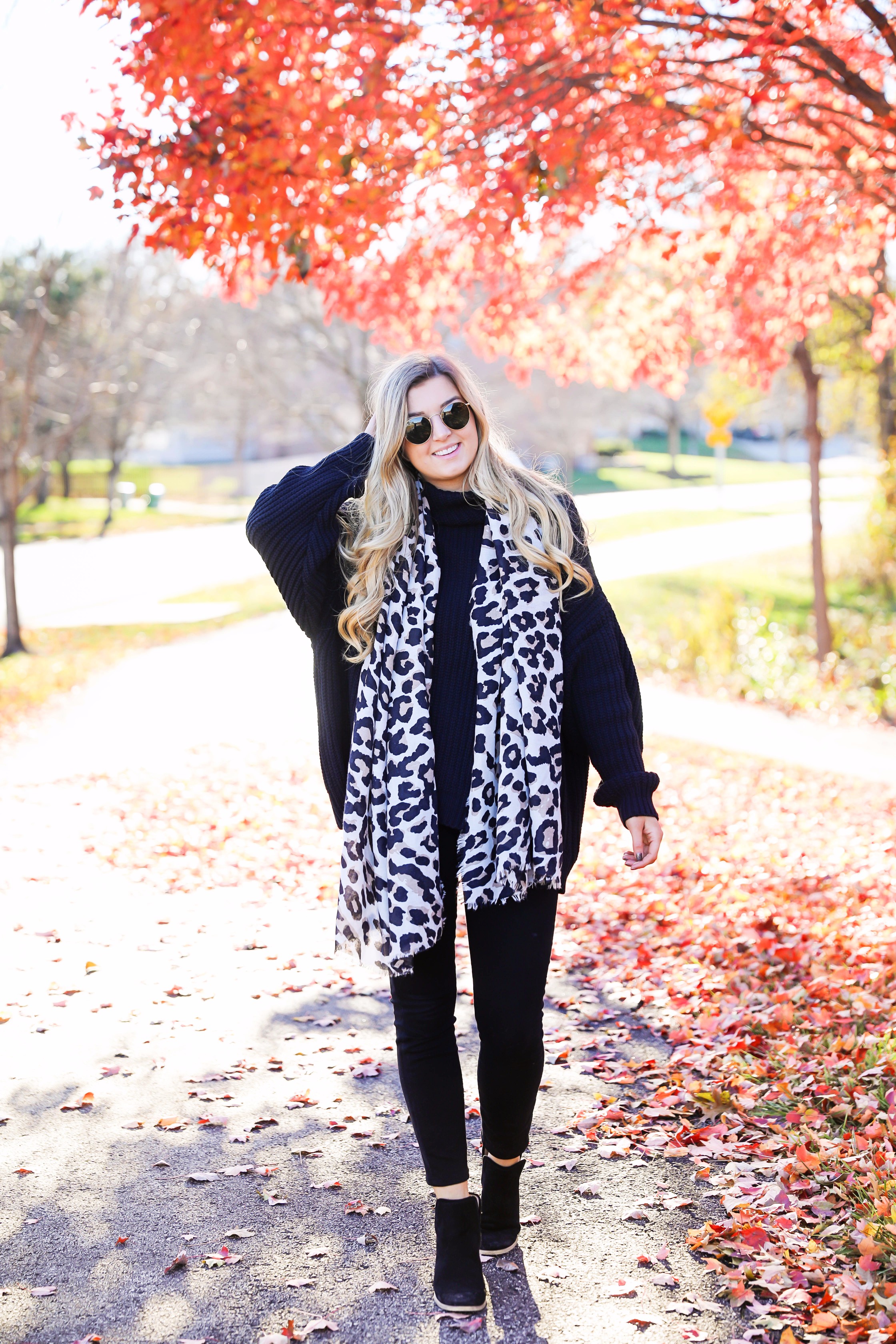 All black outfit with leopard scarf! Cute black sweater and black jeans with black booties! Plus a roundup of black friday and cyber monday sale deals on fashion blog daily dose of charm by lauren lindmark