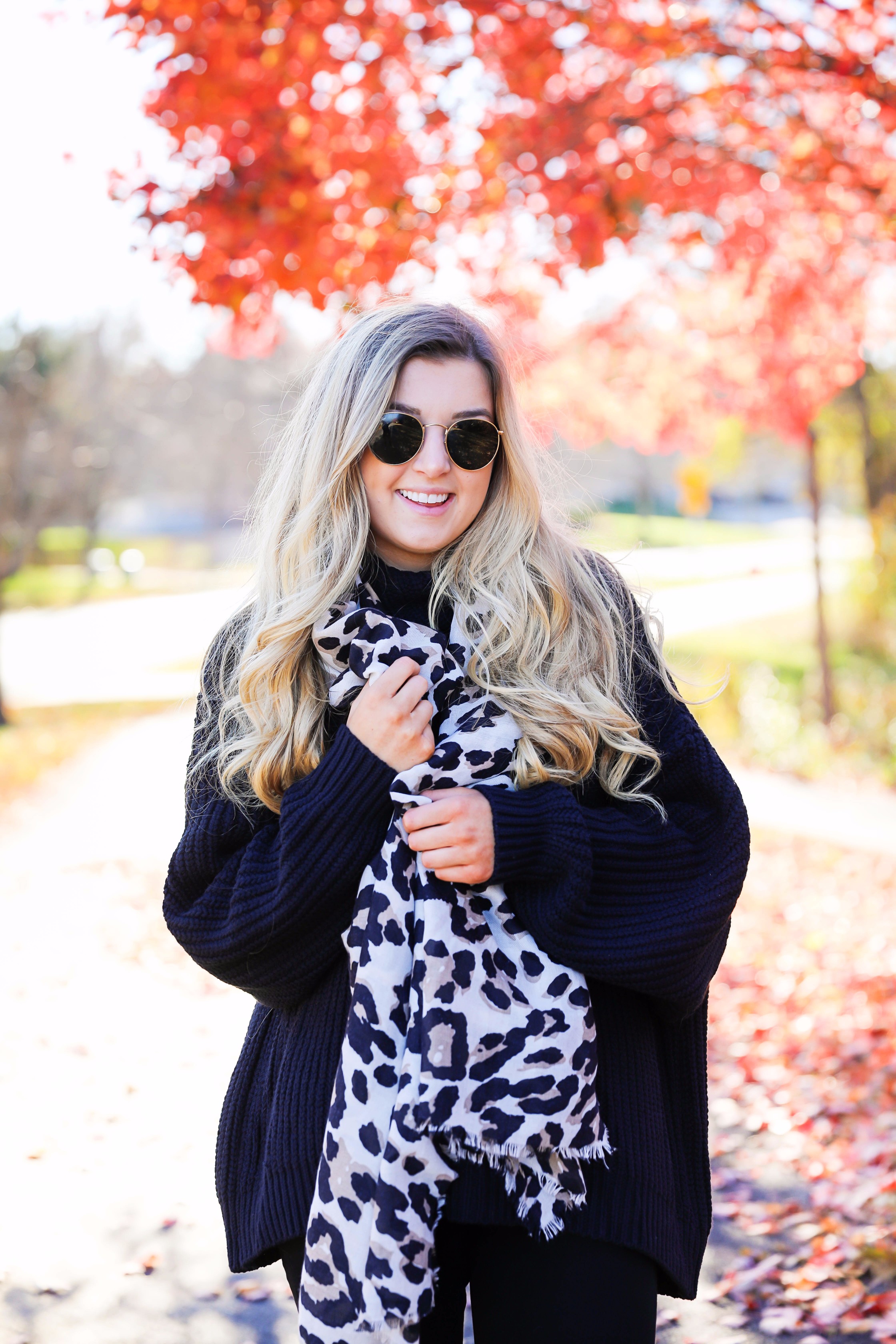 All black outfit with leopard scarf! Cute black sweater and black jeans with black booties! Plus a roundup of black friday and cyber monday sale deals on fashion blog daily dose of charm by lauren lindmark