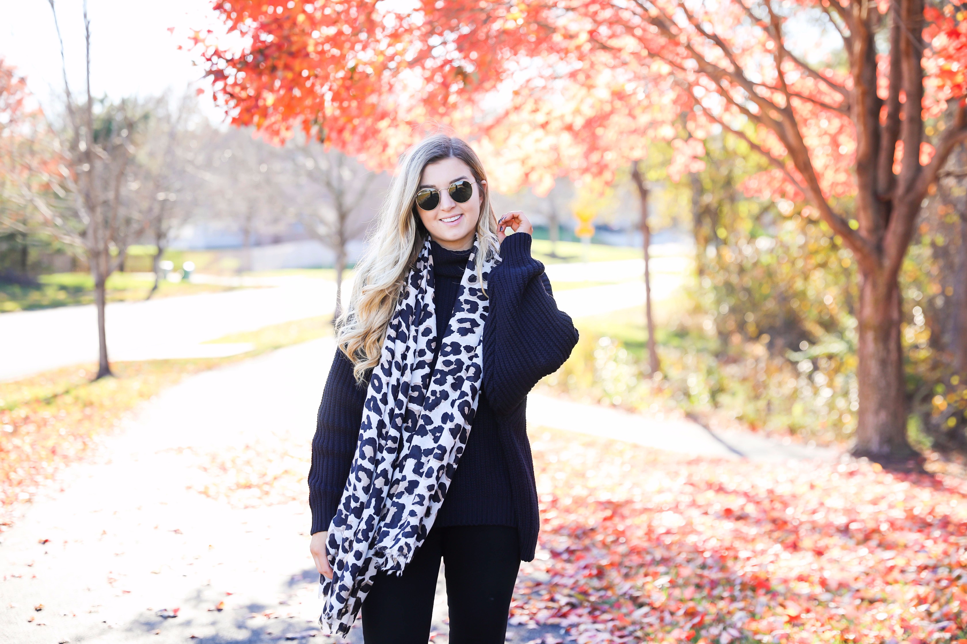 All black outfit with leopard scarf! Cute black sweater and black jeans with black booties! Plus a roundup of black friday and cyber monday sale deals on fashion blog daily dose of charm by lauren lindmark