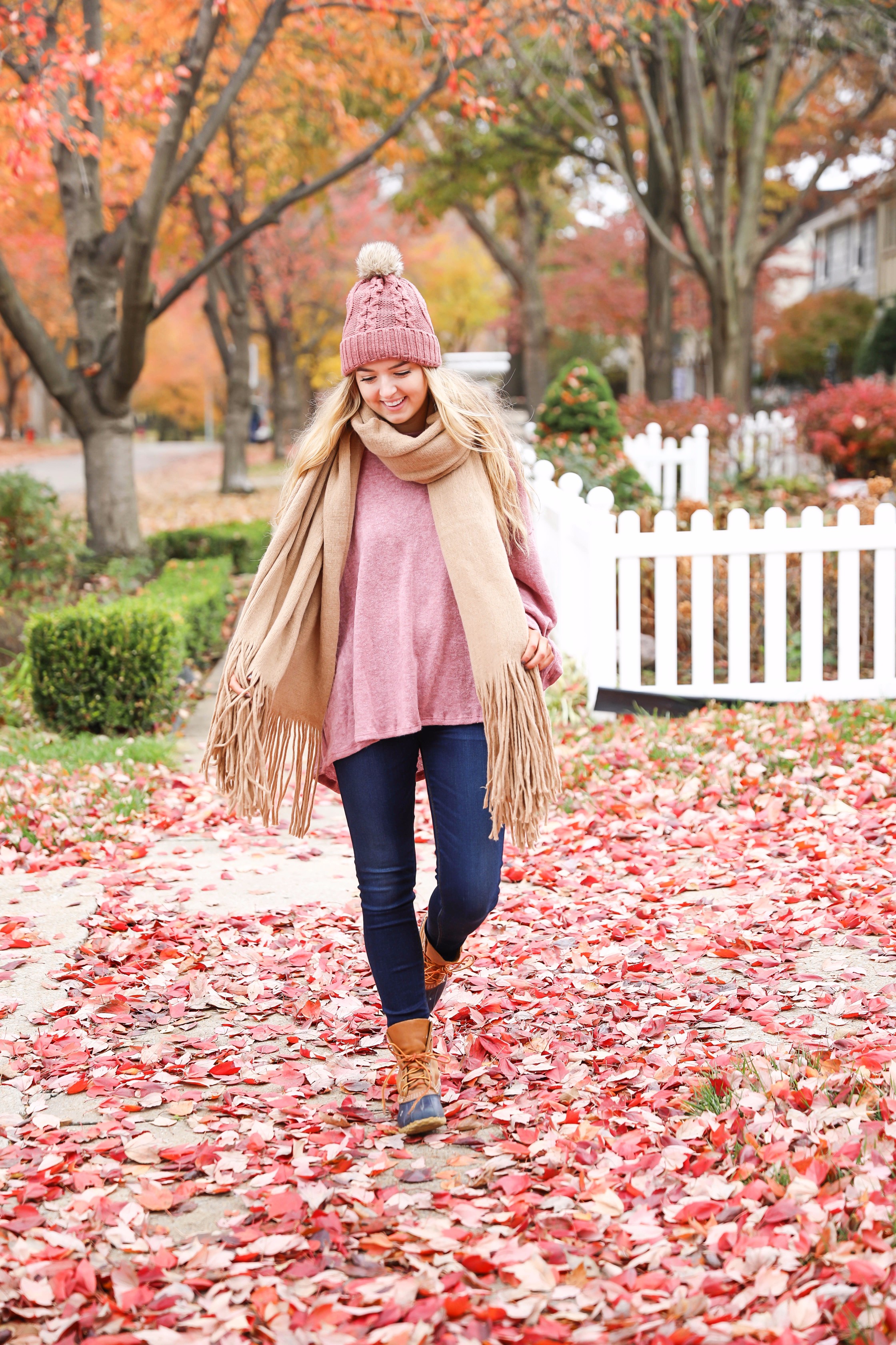 Big fringe scarf with pink tied sweater and pink beanie! Perfect girly fall outfit! Find details on fashion blog daily dose of charm by lauren lindmark