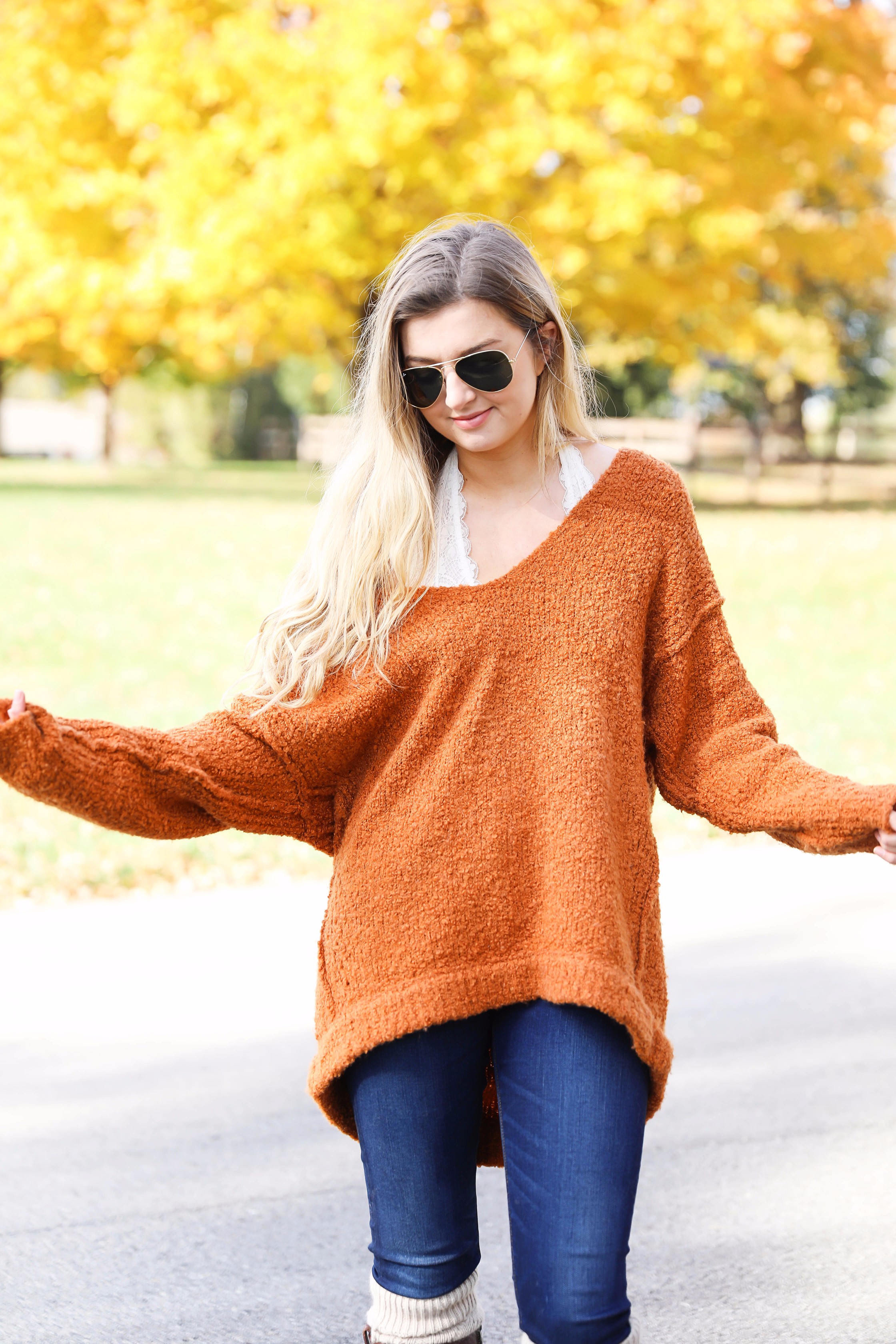 Burnt orange soft free people sweater paired with frye boots and cable knit socks. Fall fashion inspiration! Get details on daily dose of charm fashion blog lauren lindmark