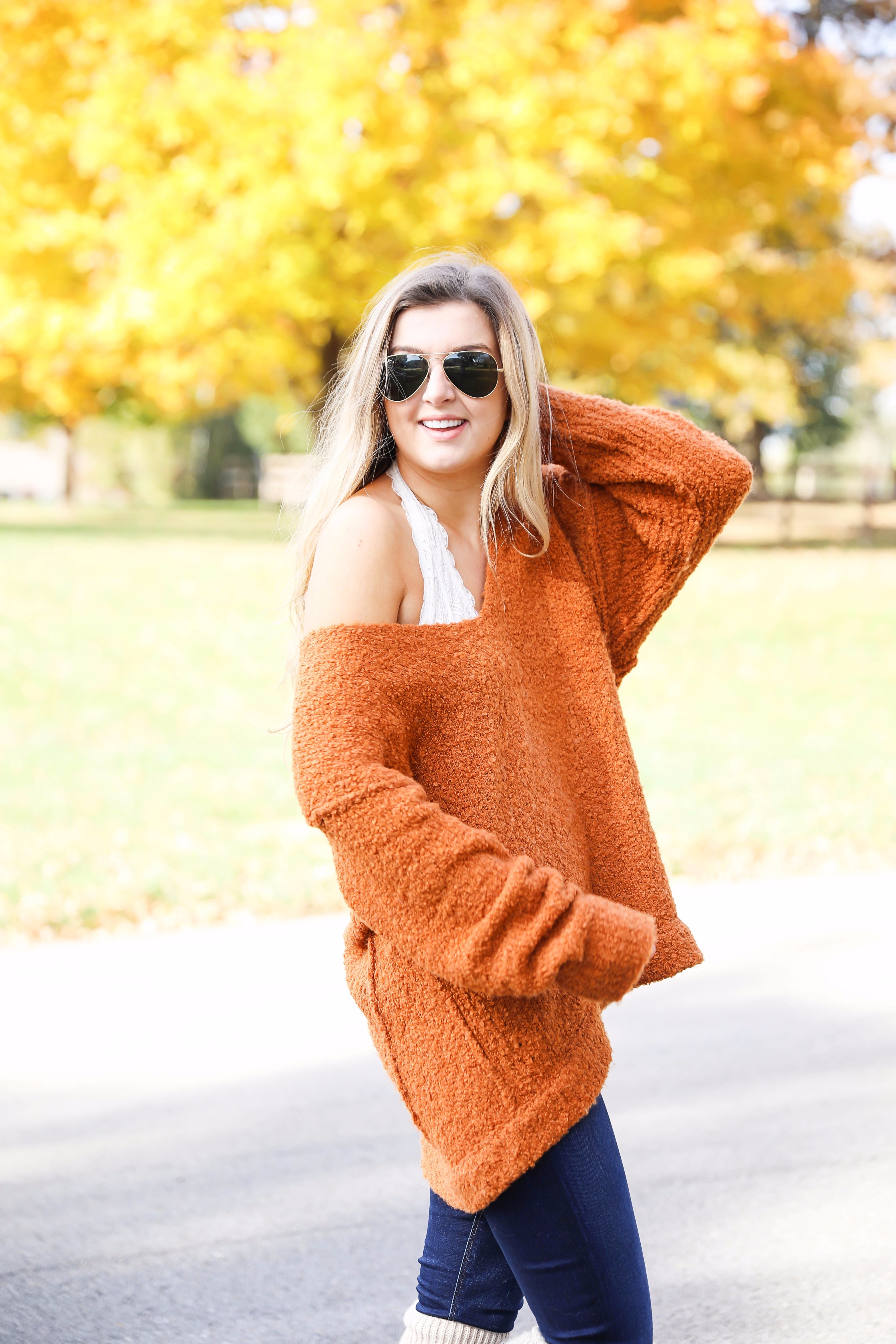 Burnt orange soft free people sweater paired with frye boots and cable knit socks. Fall fashion inspiration! Get details on daily dose of charm fashion blog lauren lindmark