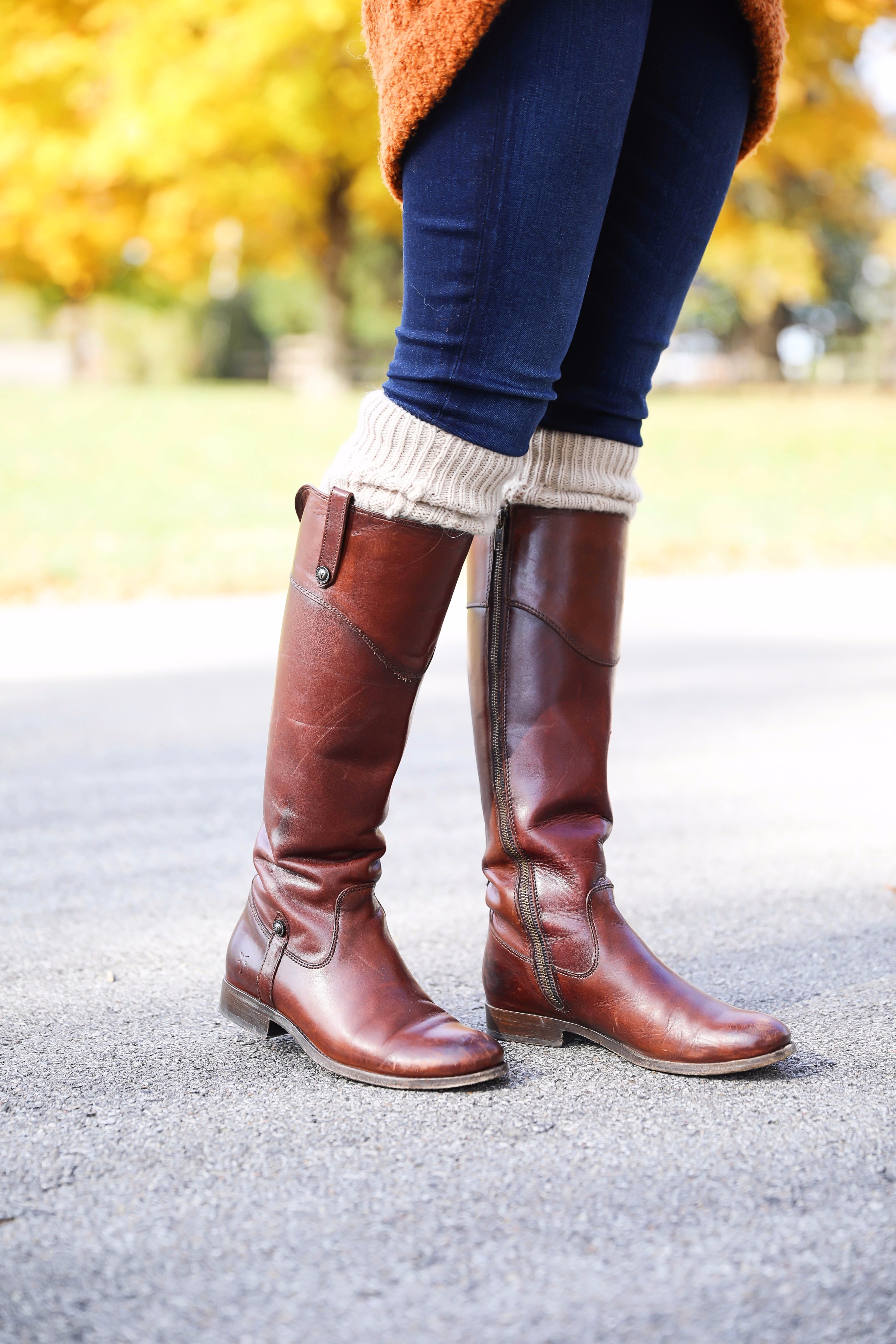 Burnt orange soft free people sweater paired with frye boots and cable knit socks. Fall fashion inspiration! Get details on daily dose of charm fashion blog lauren lindmark