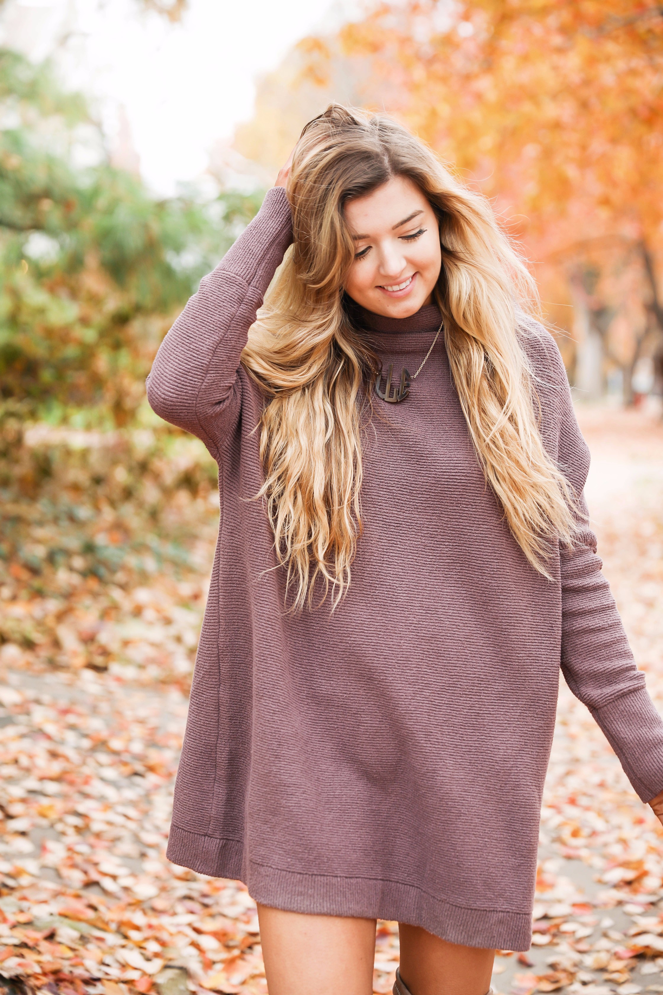 Purple free people Ottoman Slouchy Tunics weater dress! This cute fall look is perfect paired with brown suede over the knee boots! Find the details on fashion blog daily dose of charm by lauren lindmark