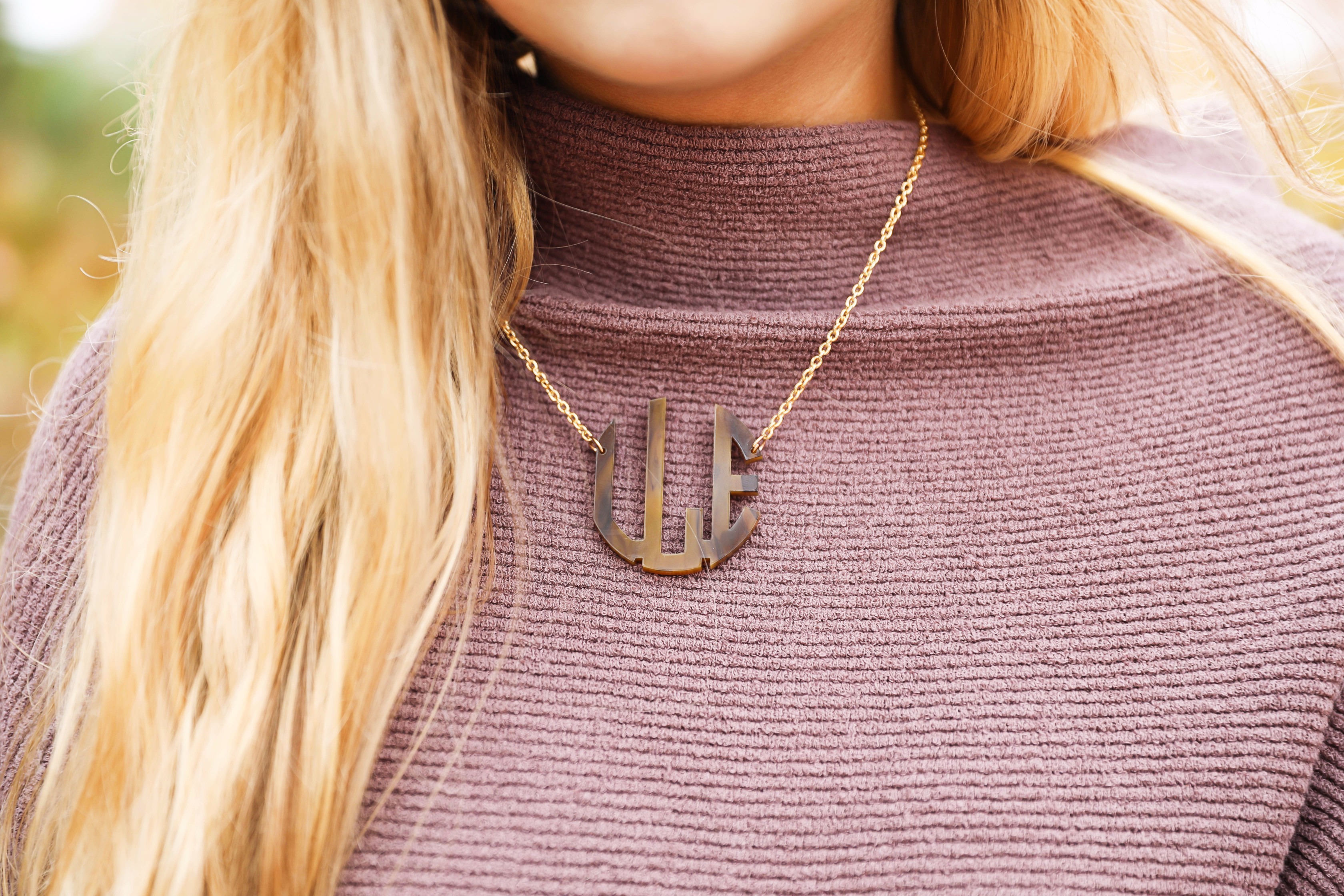 Purple free people Ottoman Slouchy Tunics weater dress! This cute fall look is perfect paired with brown suede over the knee boots! Find the details on fashion blog daily dose of charm by lauren lindmark