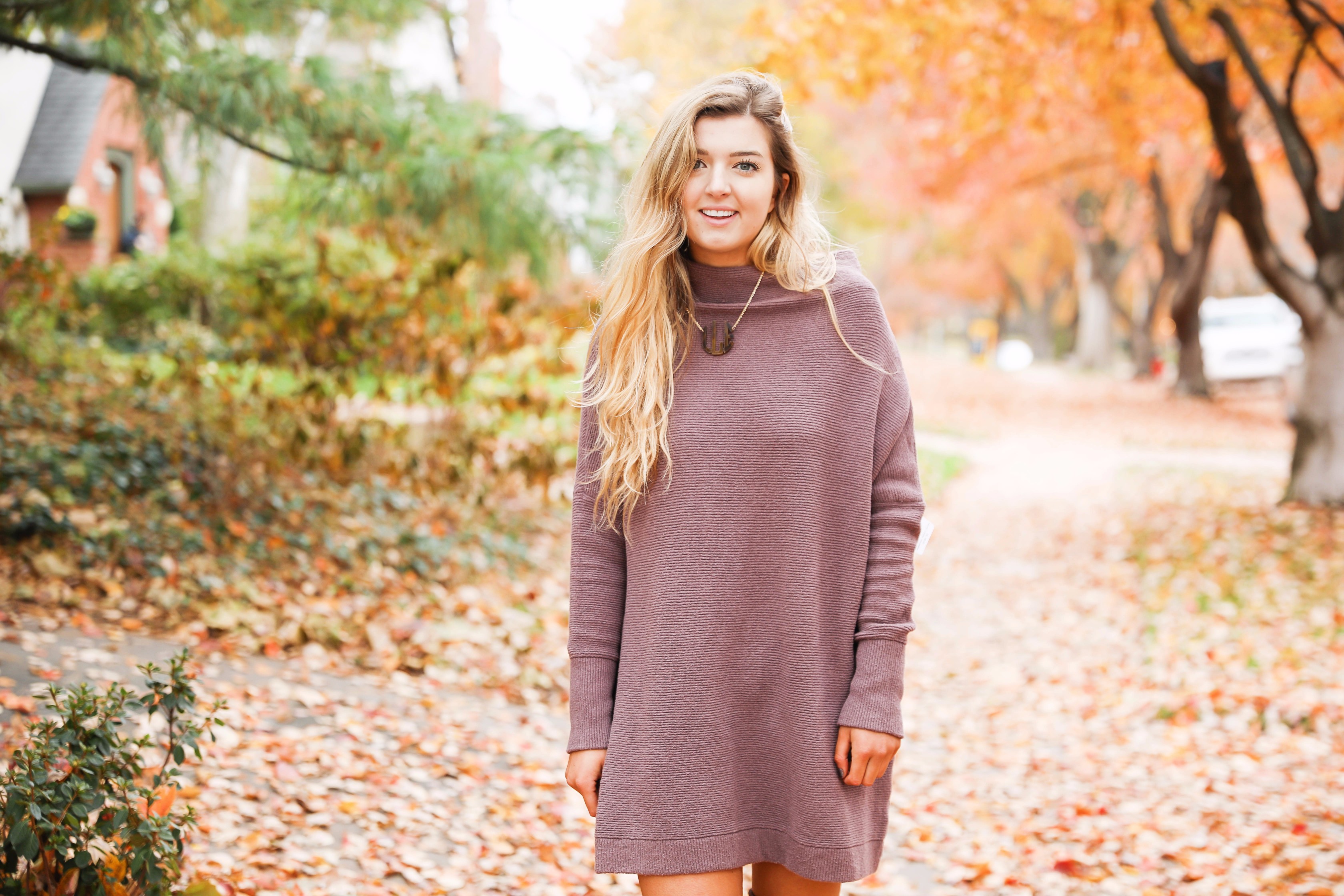 Purple free people Ottoman Slouchy Tunics weater dress! This cute fall look is perfect paired with brown suede over the knee boots! Find the details on fashion blog daily dose of charm by lauren lindmark