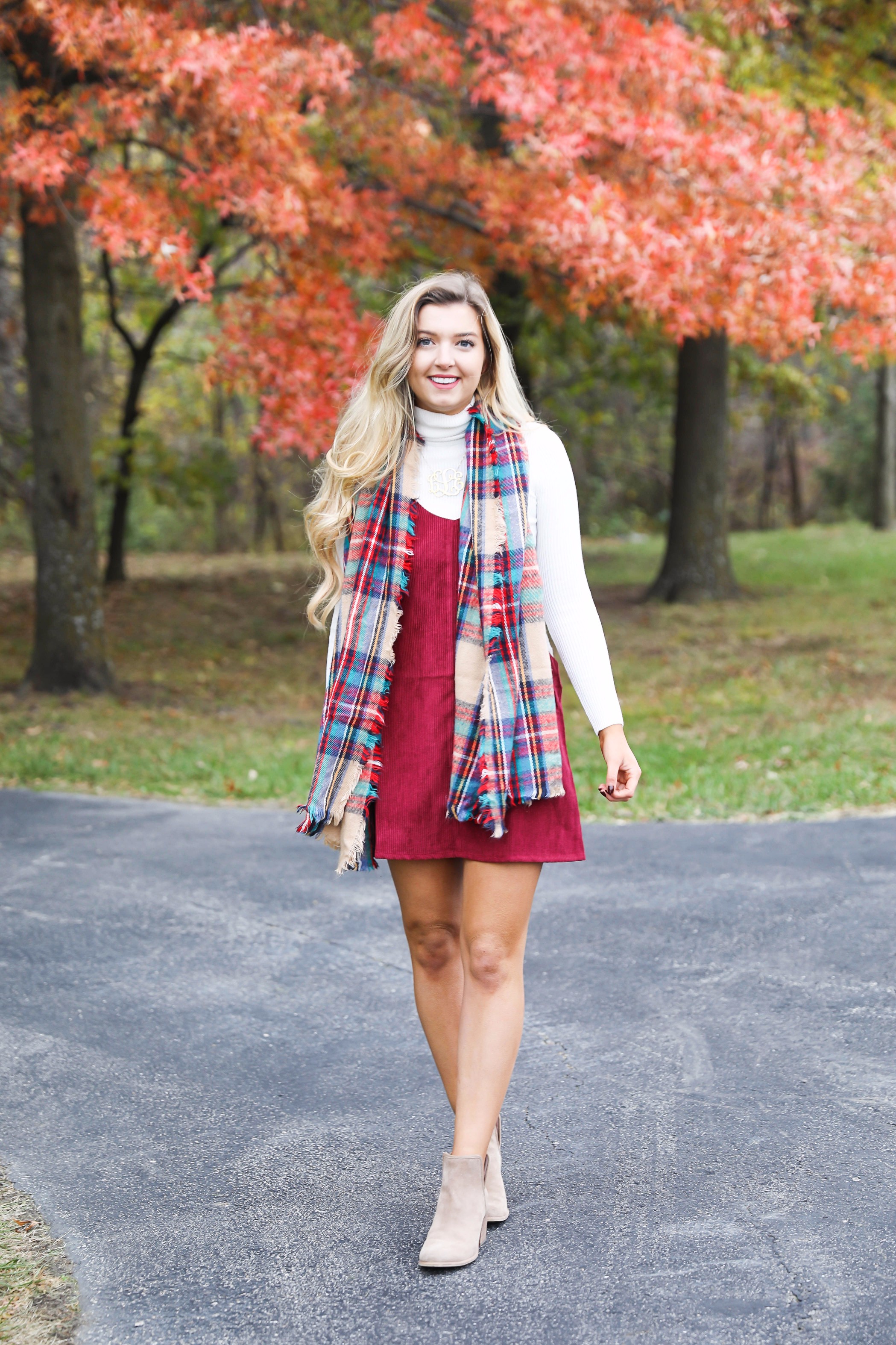 Red corduroy overall dress with white turtleneck and blanket scarf! The cutest fall outfit for a fall trees and foliage photoshoot! Get details on fashion blog daily dose of charm lauren lindmark