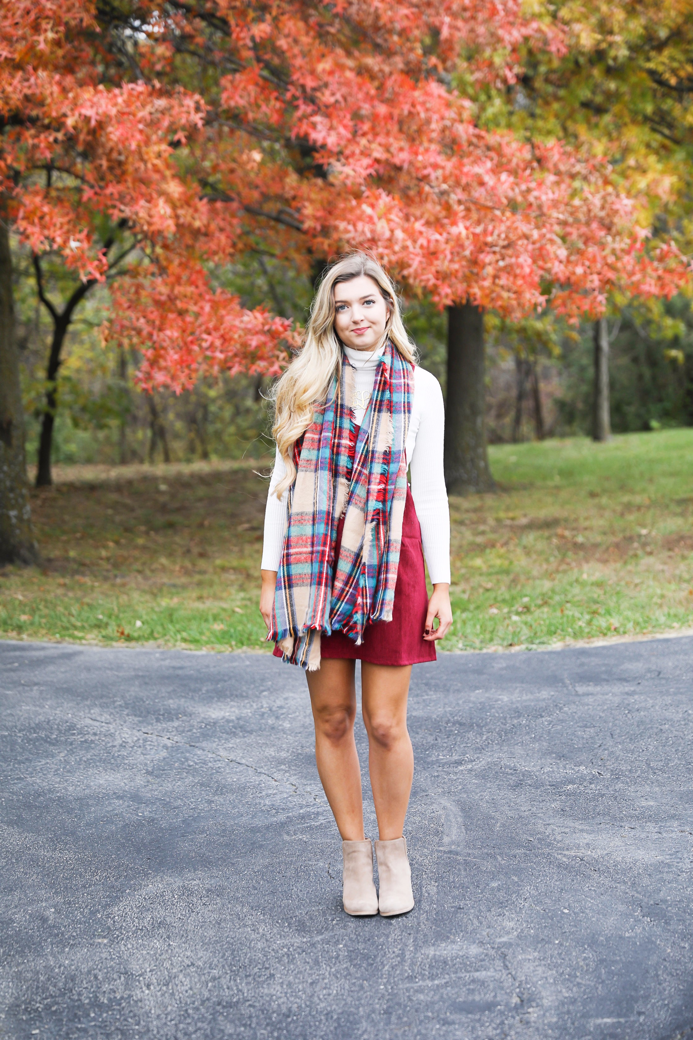 Red corduroy overall dress with white turtleneck and blanket scarf! The cutest fall outfit for a fall trees and foliage photoshoot! Get details on fashion blog daily dose of charm lauren lindmark