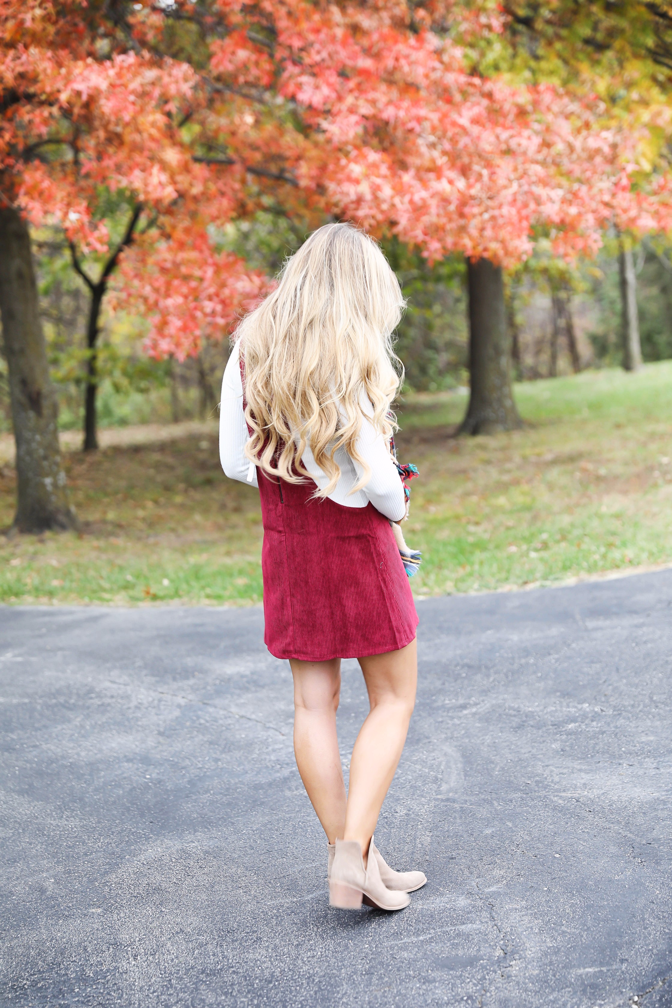 Red corduroy overall dress with white turtleneck and blanket scarf! The cutest fall outfit for a fall trees and foliage photoshoot! Get details on fashion blog daily dose of charm lauren lindmark