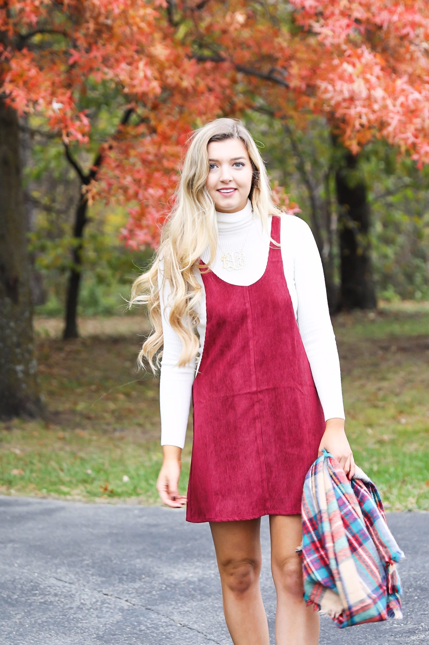 Red corduroy overall dress with white turtleneck and blanket scarf! The cutest fall outfit for a fall trees and foliage photoshoot! Get details on fashion blog daily dose of charm lauren lindmark