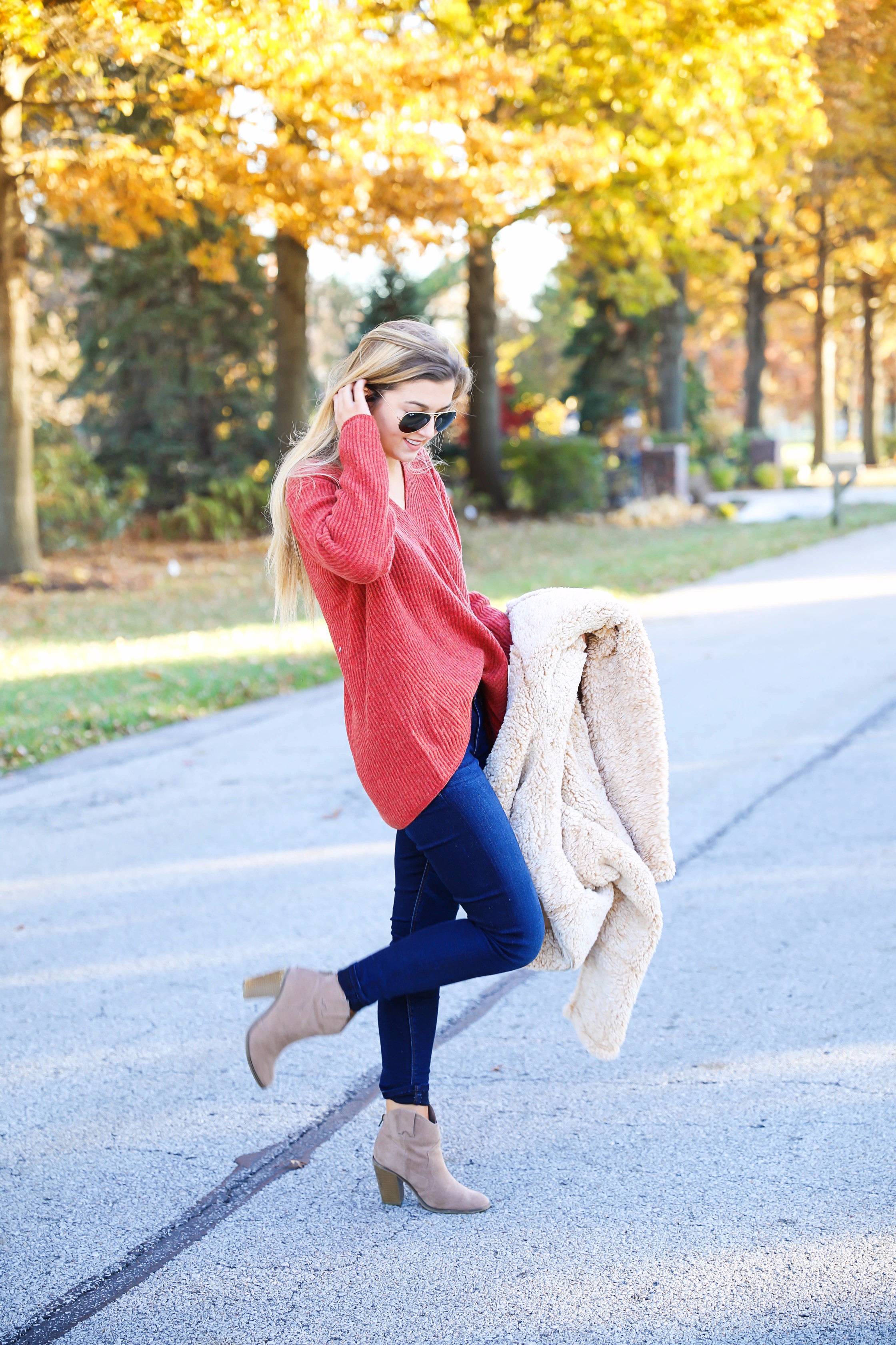 Red sweater and teddy bear coat! This adorable fall outfit is so cozy and the teddy bear coat is so inexpensive! Find the details on fashion blog daily dose of charm by lauren lindmark