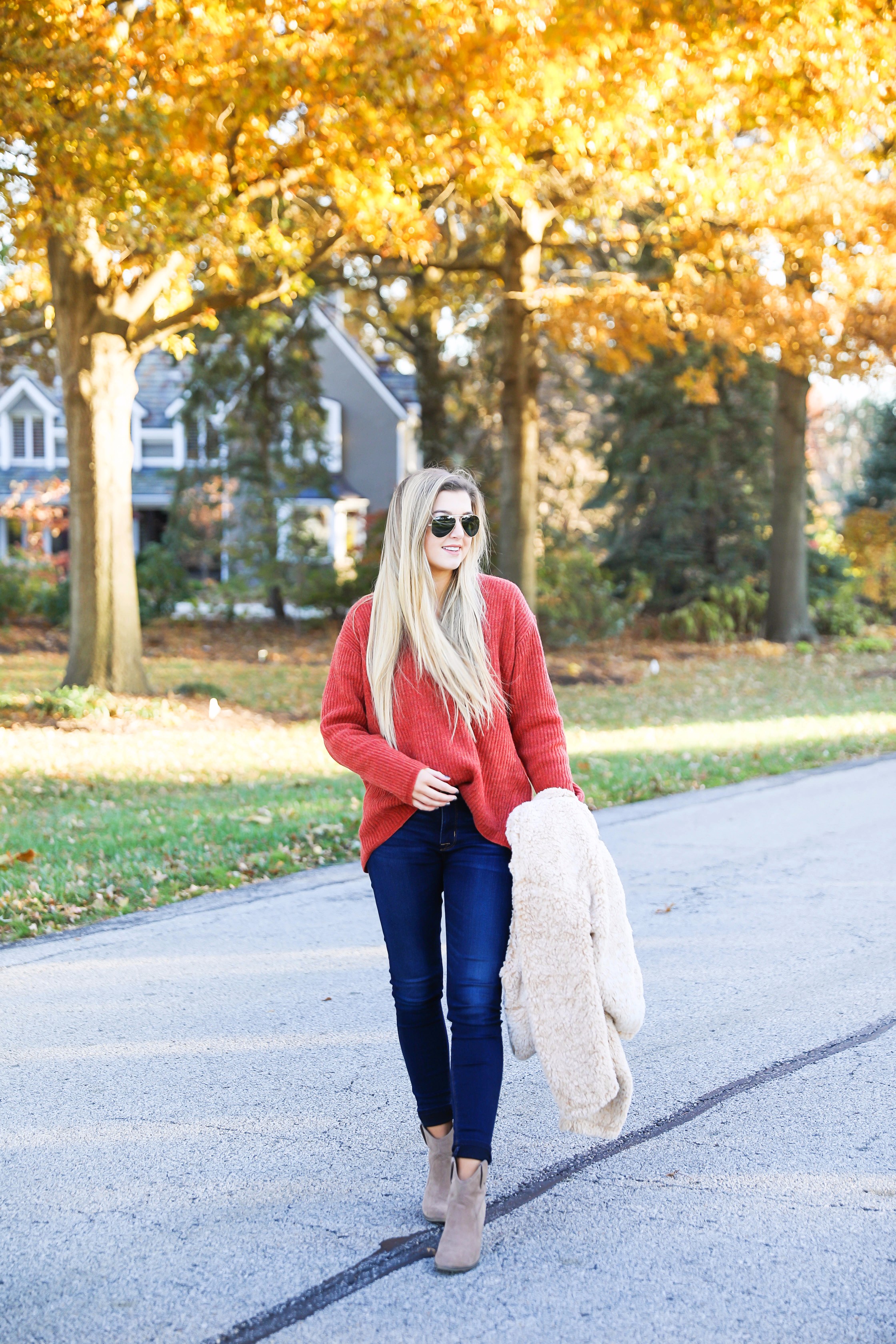 Red sweater and teddy bear coat! This adorable fall outfit is so cozy and the teddy bear coat is so inexpensive! Find the details on fashion blog daily dose of charm by lauren lindmark