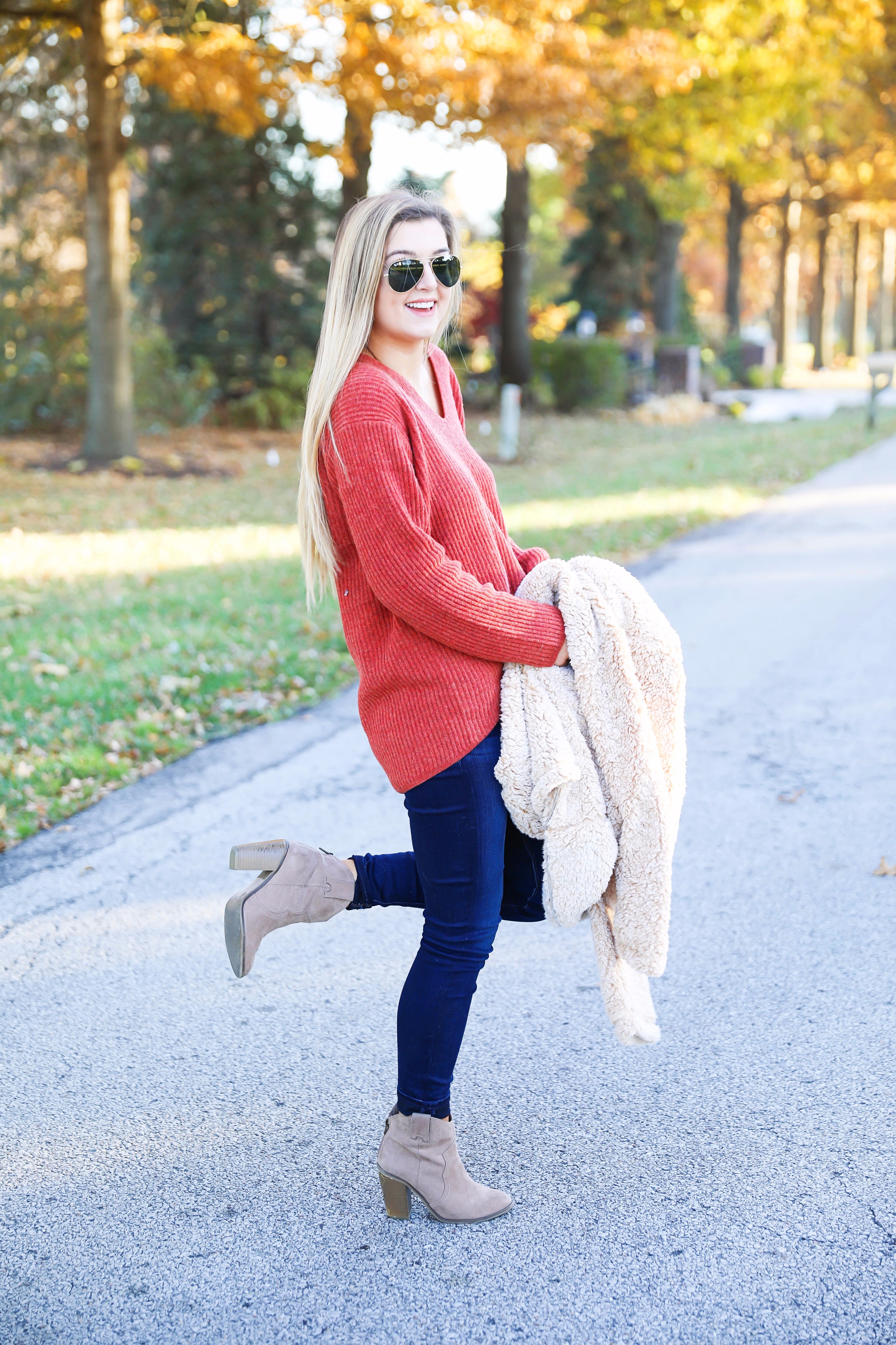 Red sweater and teddy bear coat! This adorable fall outfit is so cozy and the teddy bear coat is so inexpensive! Find the details on fashion blog daily dose of charm by lauren lindmark