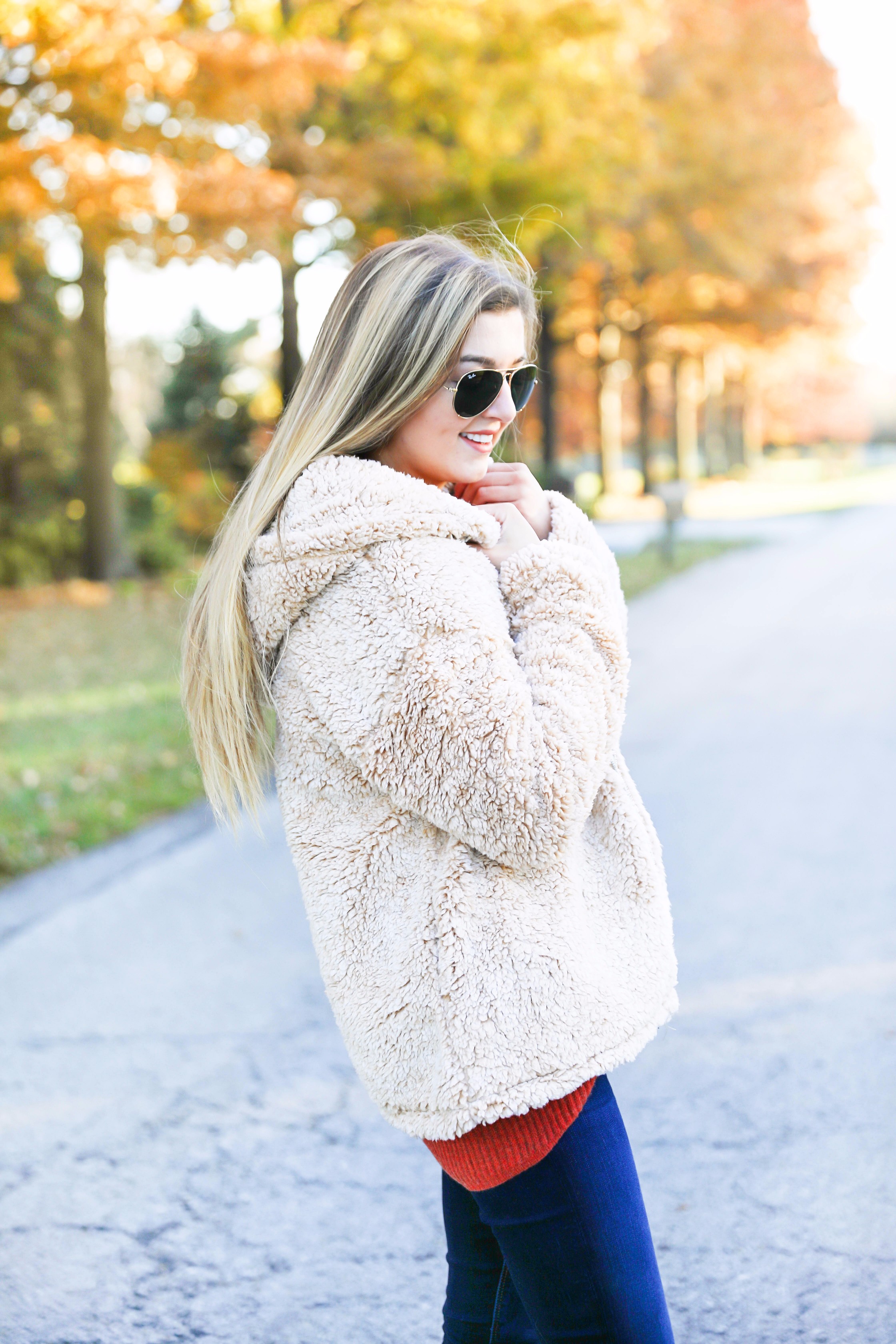 Red sweater and teddy bear coat! This adorable fall outfit is so cozy and the teddy bear coat is so inexpensive! Find the details on fashion blog daily dose of charm by lauren lindmark