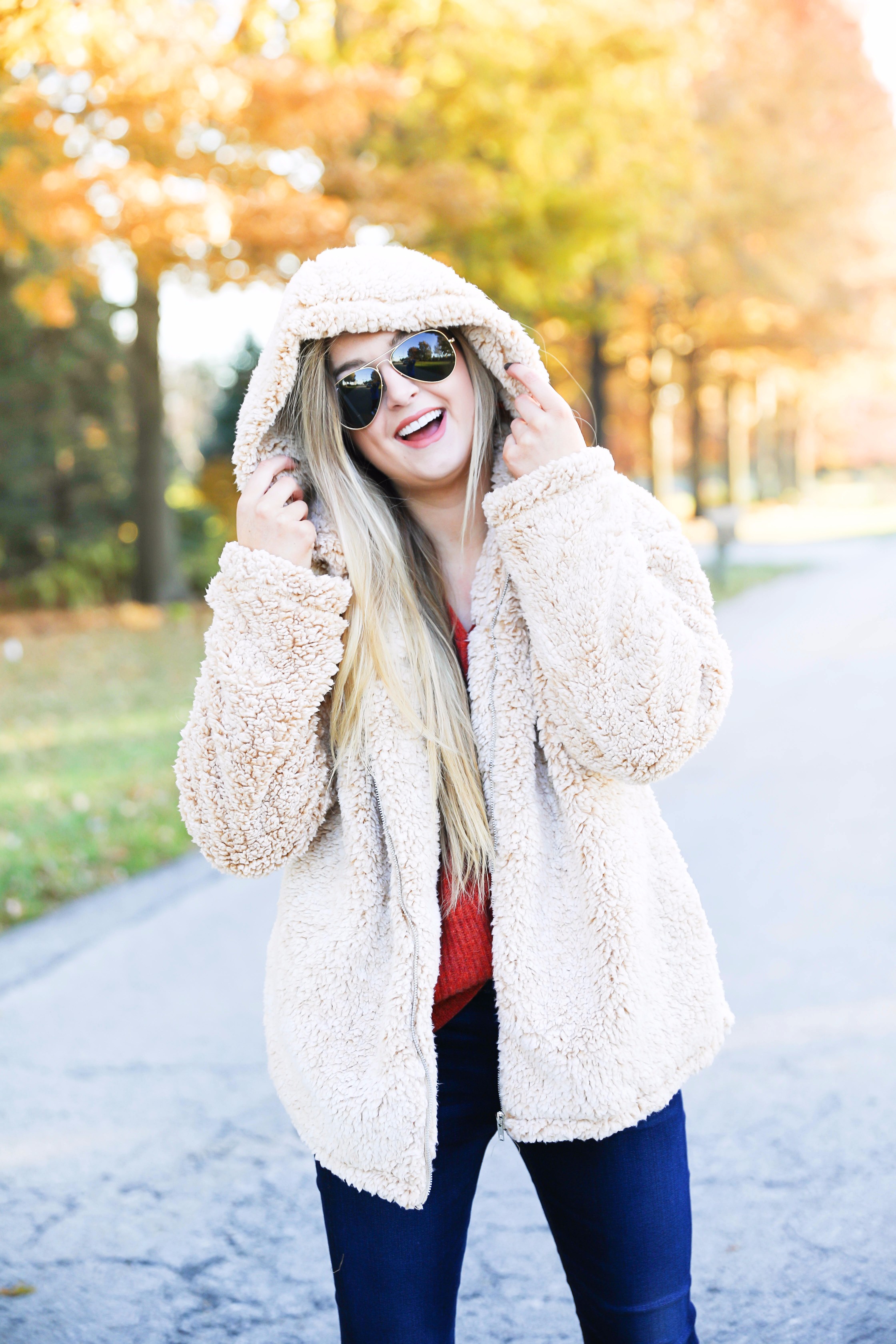 Red sweater and teddy bear coat! This adorable fall outfit is so cozy and the teddy bear coat is so inexpensive! Find the details on fashion blog daily dose of charm by lauren lindmark