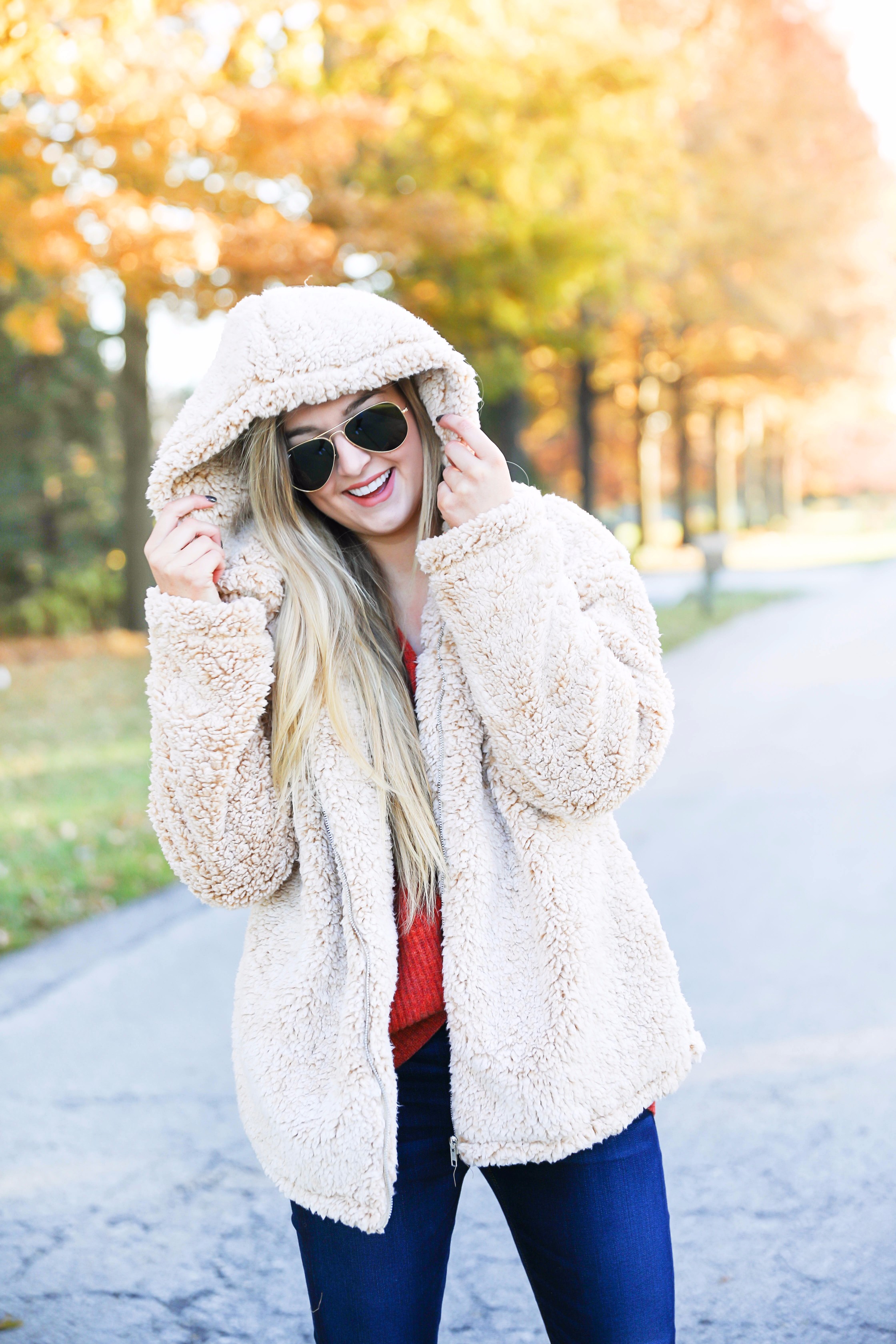 Red sweater and teddy bear coat! This adorable fall outfit is so cozy and the teddy bear coat is so inexpensive! Find the details on fashion blog daily dose of charm by lauren lindmark