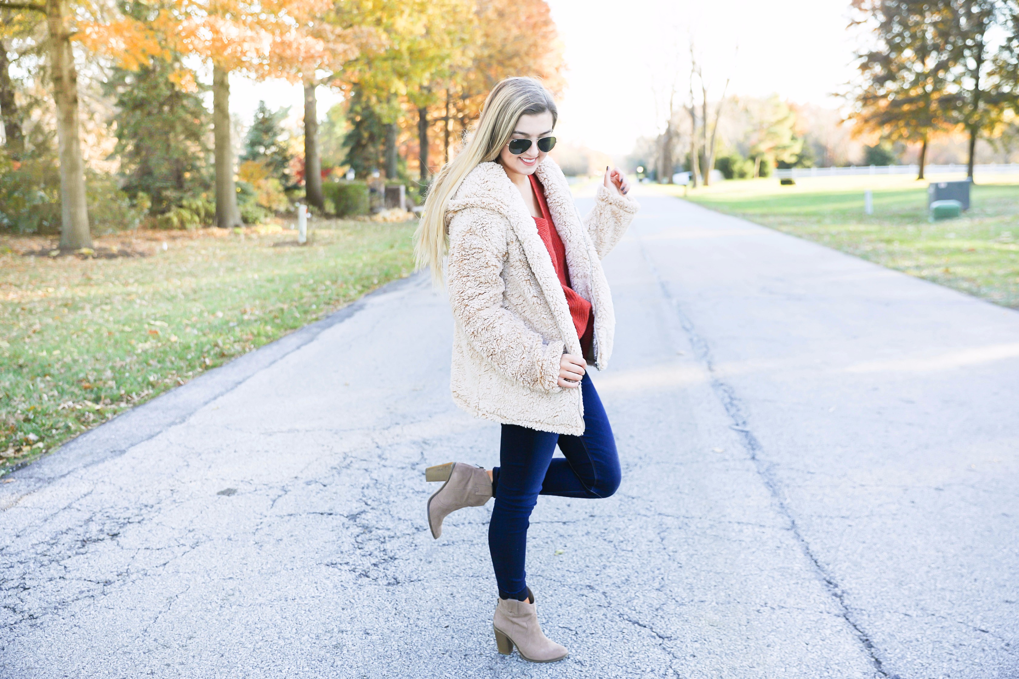 Red sweater and teddy bear coat! This adorable fall outfit is so cozy and the teddy bear coat is so inexpensive! Find the details on fashion blog daily dose of charm by lauren lindmark