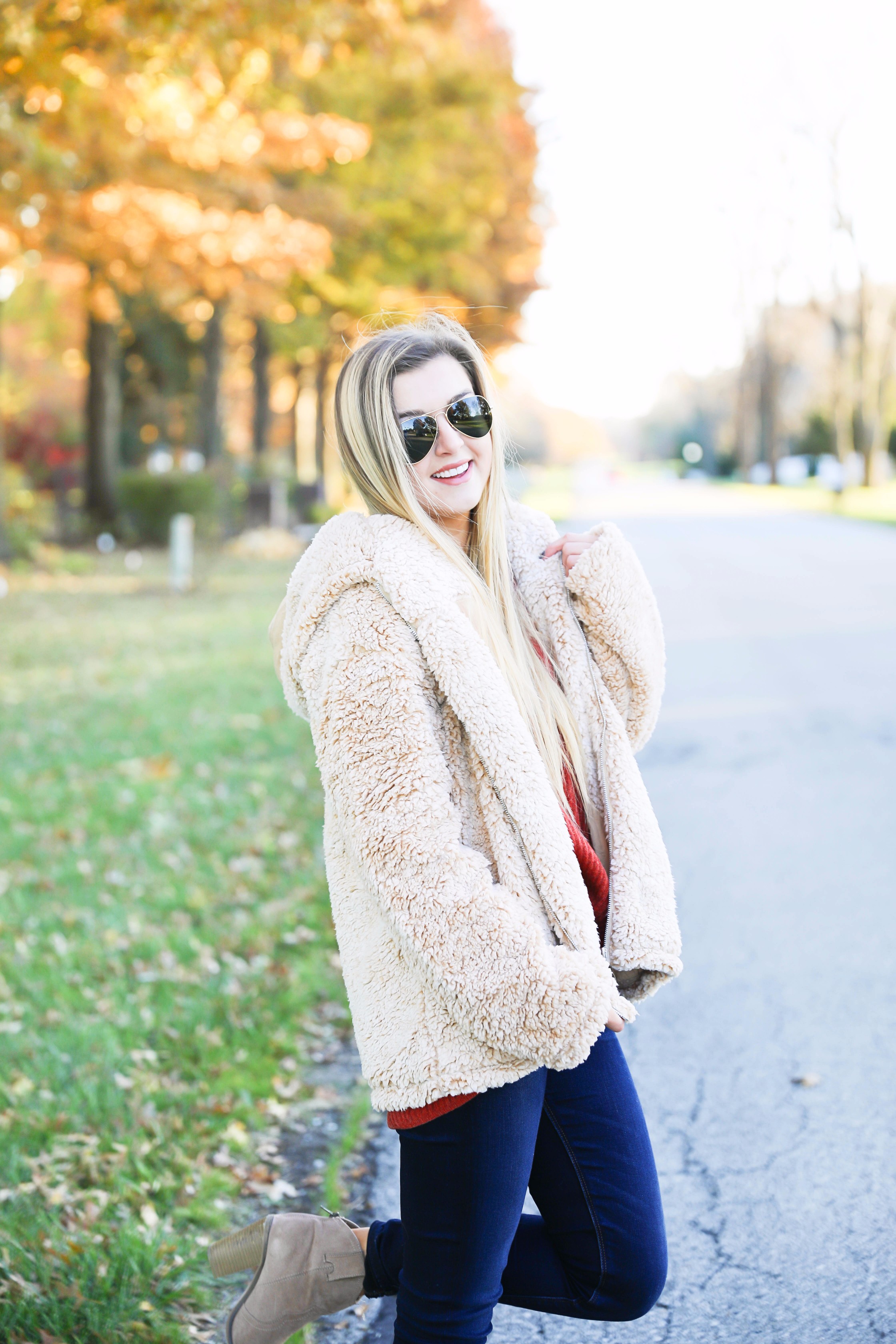 Red sweater and teddy bear coat! This adorable fall outfit is so cozy and the teddy bear coat is so inexpensive! Find the details on fashion blog daily dose of charm by lauren lindmark