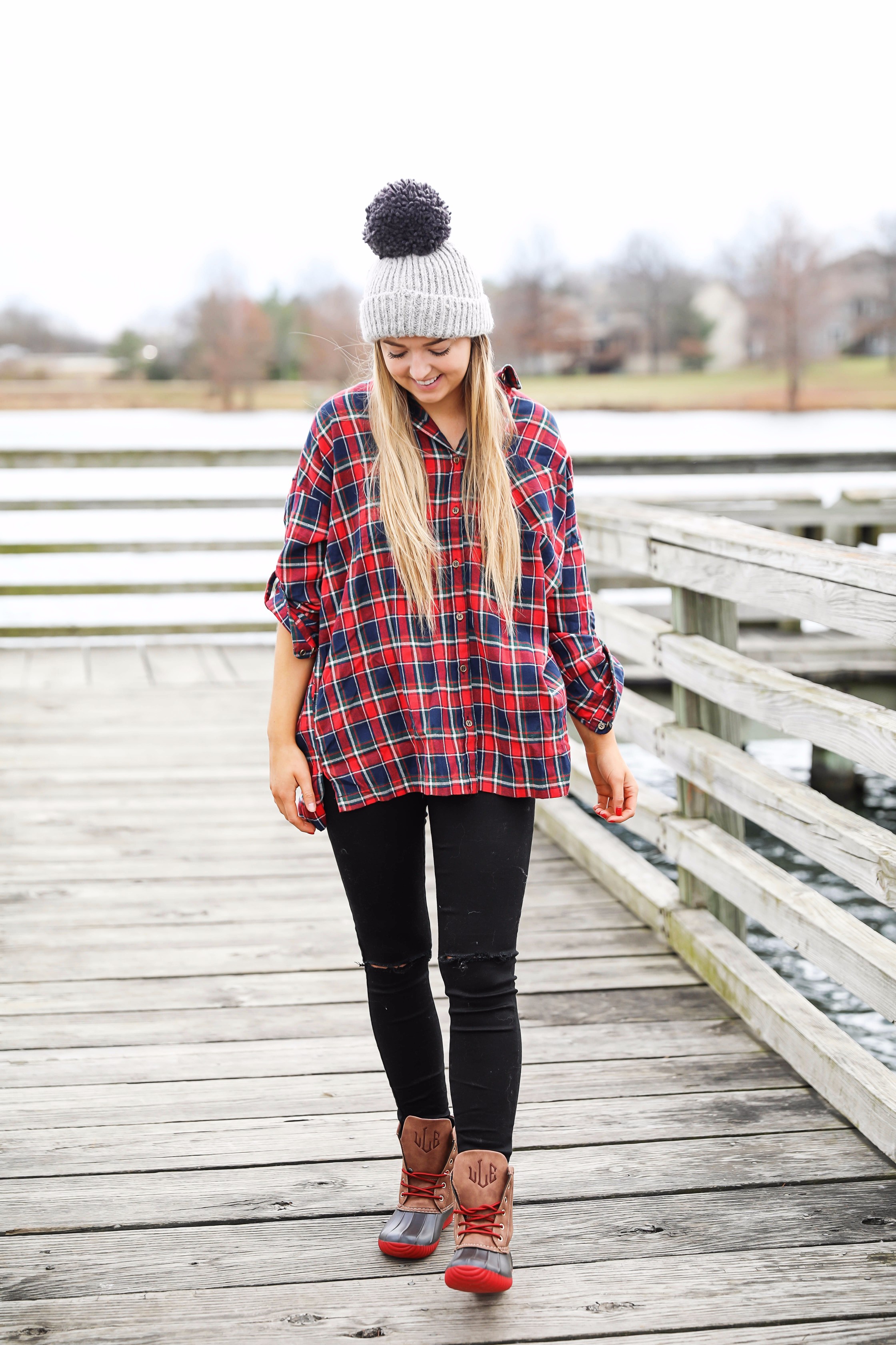 Cute flannel outfit with beanie and monogramed duck boots! Cute fall and winter camping outfit idea! Details on the fashion blog daily dose of charm by lauren lindmark