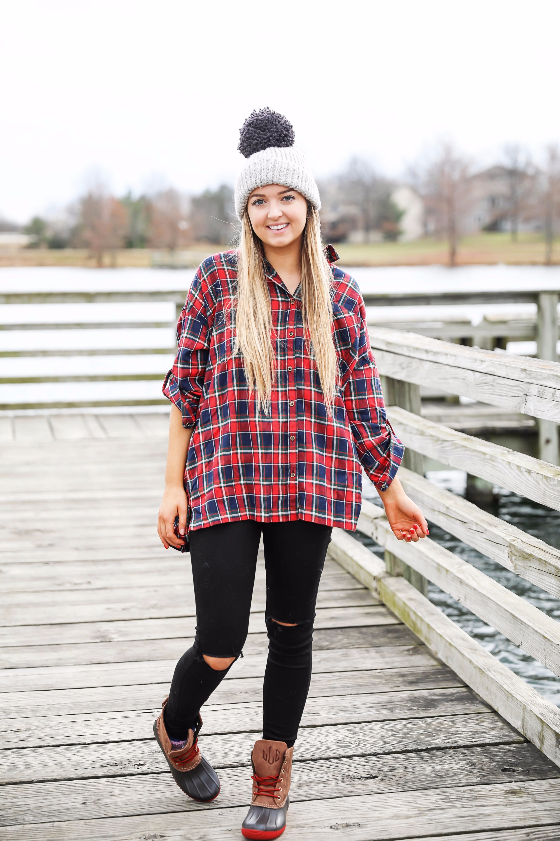 Cute flannel outfit with beanie and monogramed duck boots! Cute fall and winter camping outfit idea! Details on the fashion blog daily dose of charm by lauren lindmark