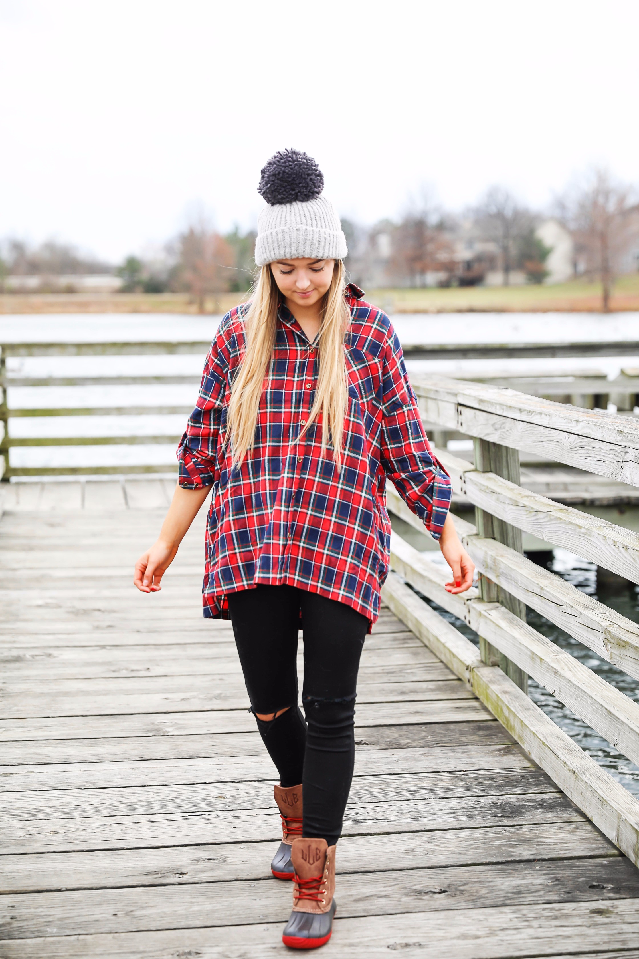 Cute flannel outfit with beanie and monogramed duck boots! Cute fall and winter camping outfit idea! Details on the fashion blog daily dose of charm by lauren lindmark