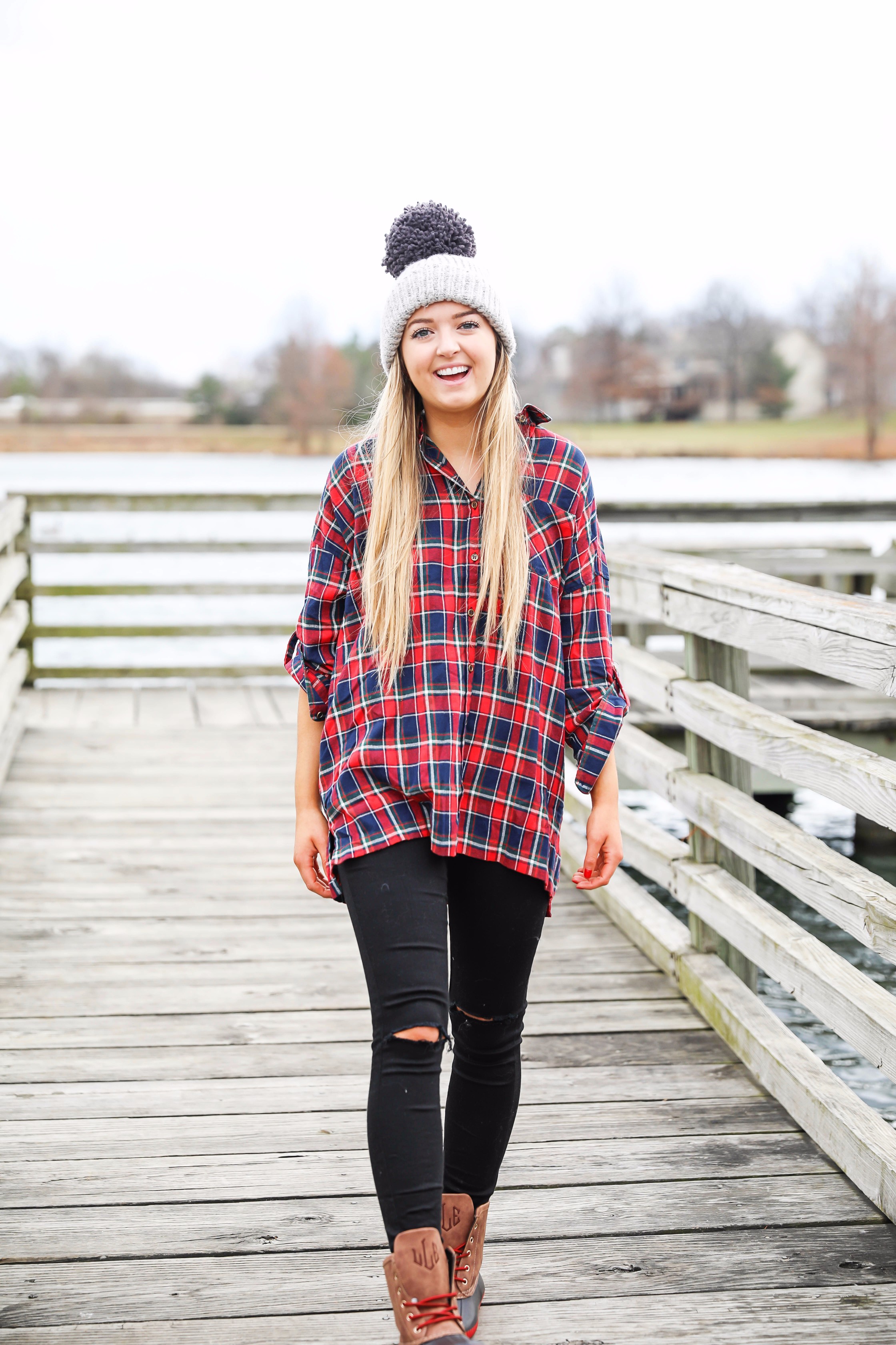 Cute flannel outfit with beanie and monogramed duck boots! Cute fall and winter camping outfit idea! Details on the fashion blog daily dose of charm by lauren lindmark