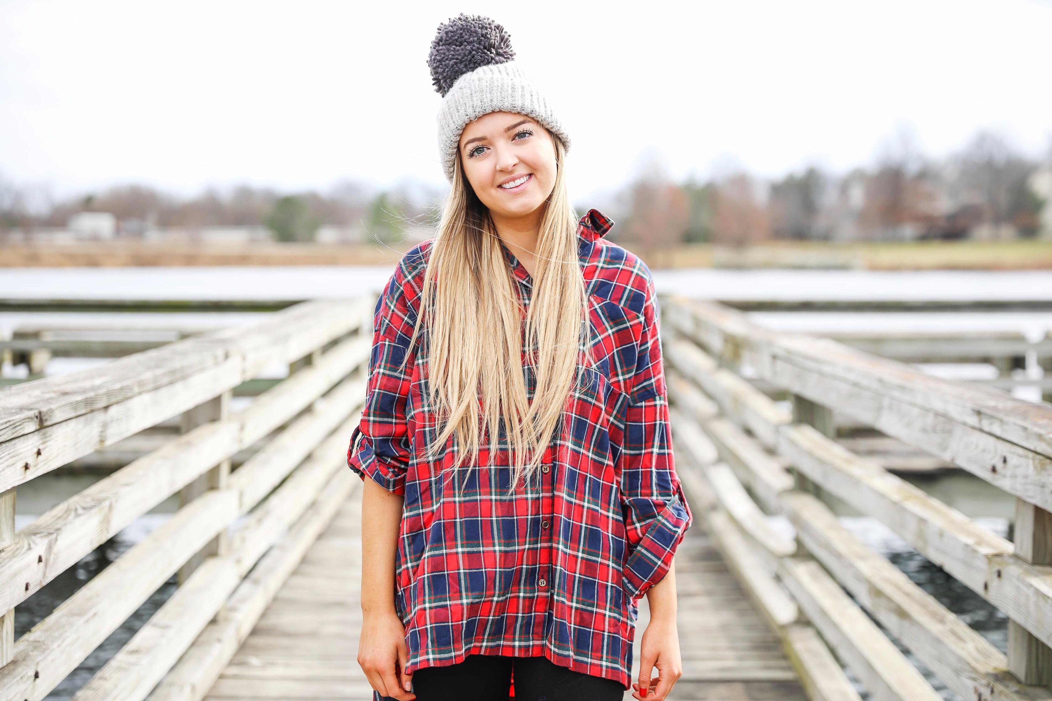 Cute flannel outfit with beanie and monogramed duck boots! Cute fall and winter camping outfit idea! Details on the fashion blog daily dose of charm by lauren lindmark