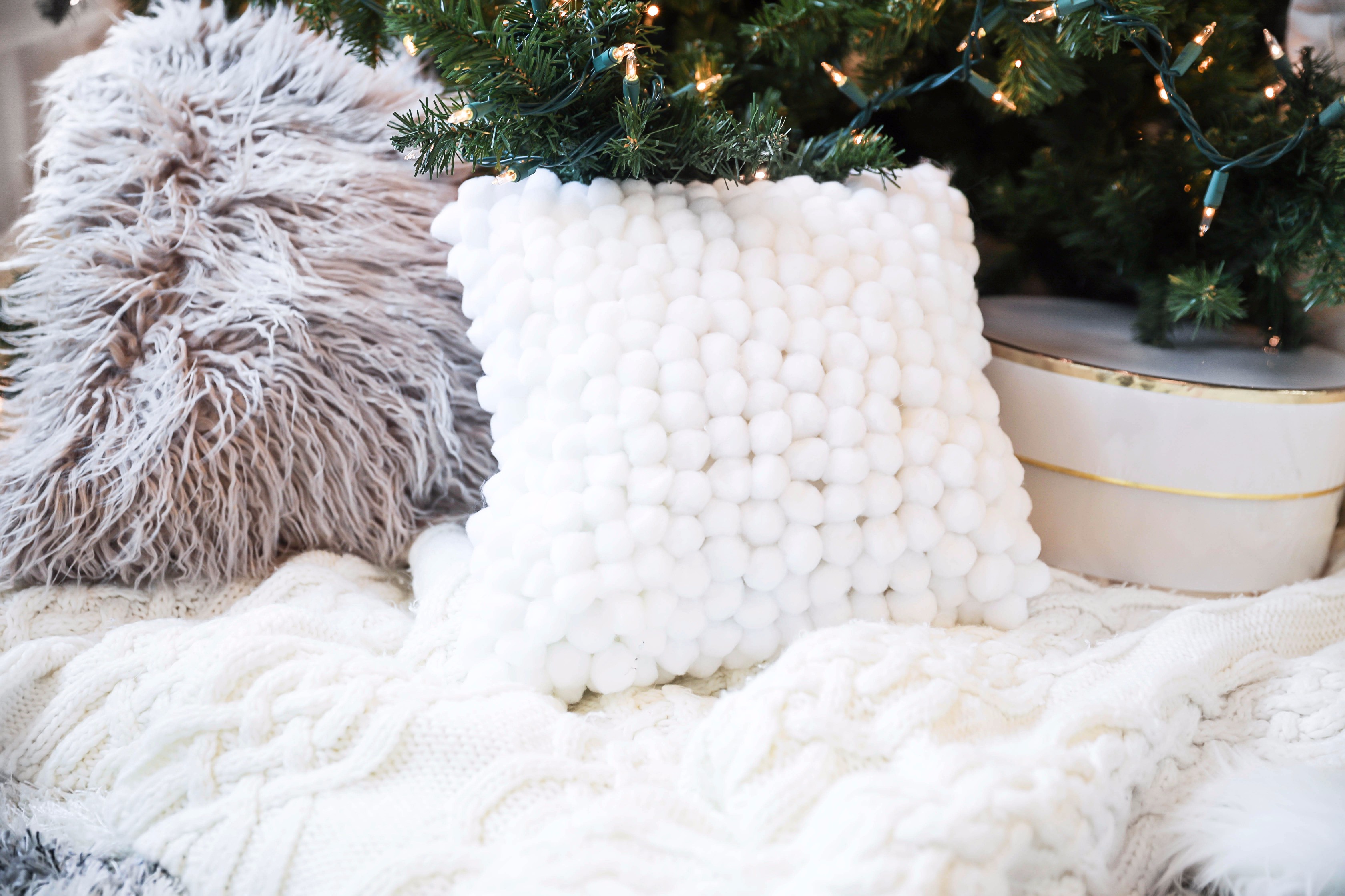 Holiday DIY decor! Learn how to make DIY snowball ornaments, tassel ornaments, pom pom ornaments, pom pom pillows, and pom pom garlands! Details on daily dose of charm lauren lindmark